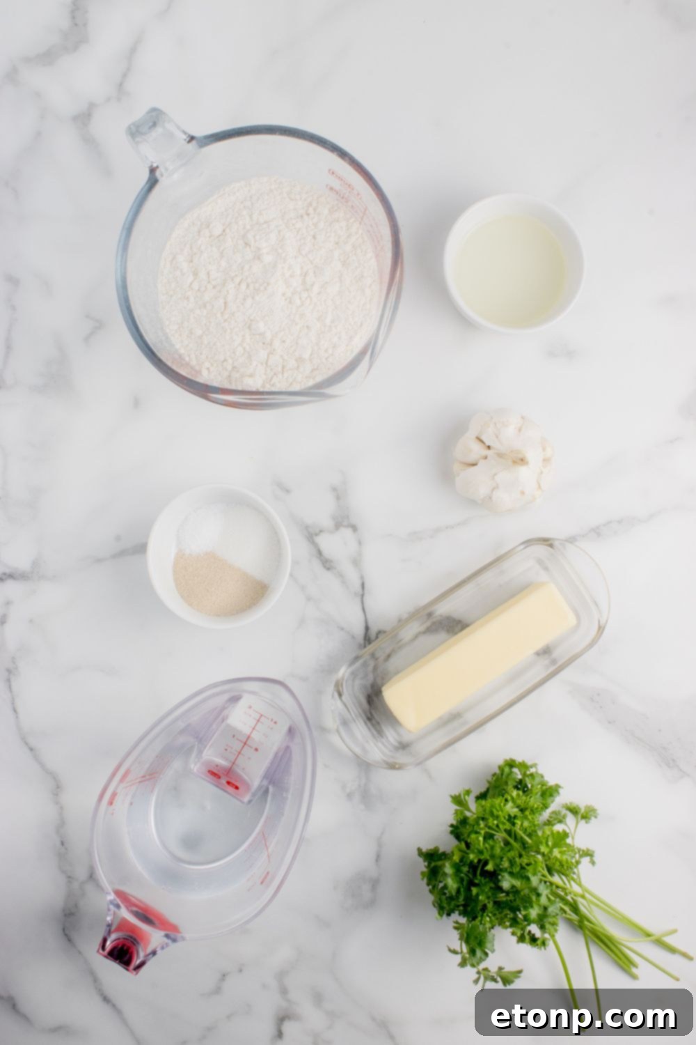 Homemade Garlic Knots ingredients in single serve bowls on table 