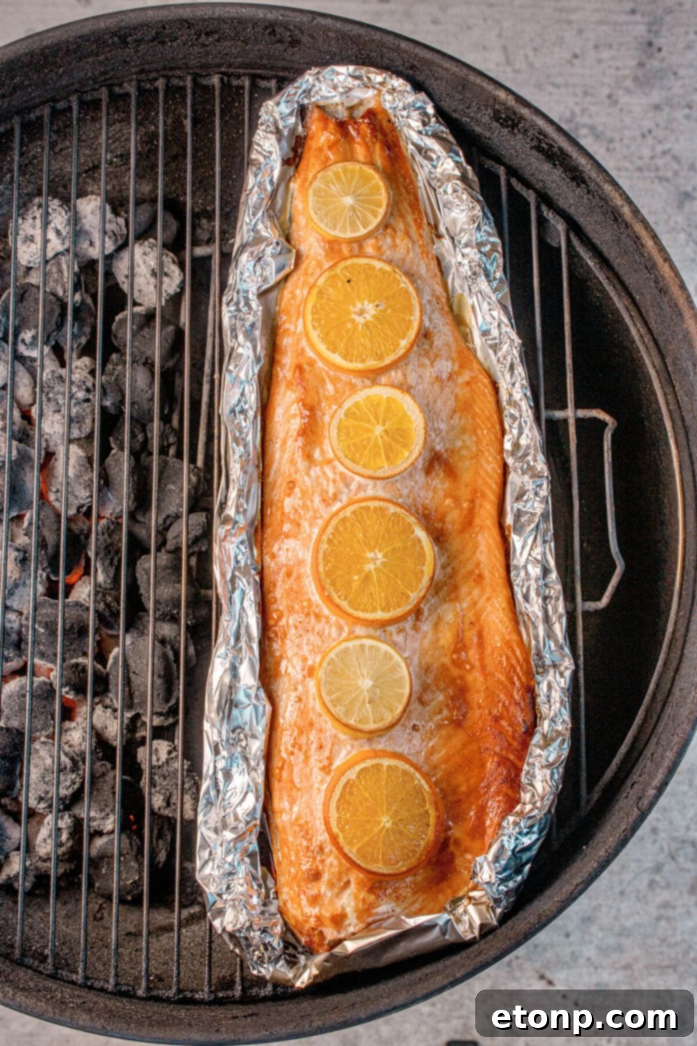Simple Grilled Honey Mustard Salmon Foil Packets 11 charcoal grill with Grilled Honey Mustard Salmon in Foil on top of rack