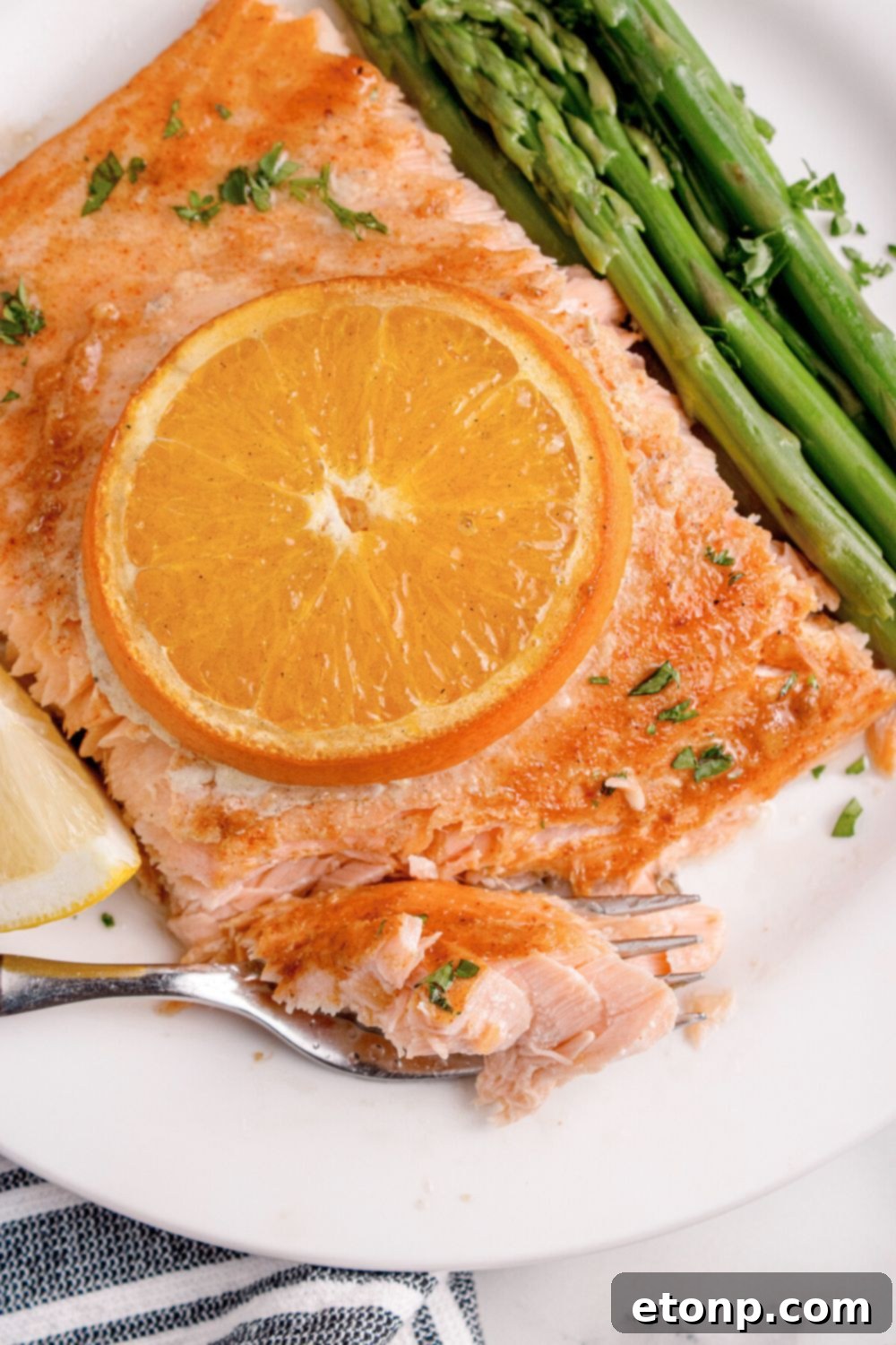 Simple Grilled Honey Mustard Salmon Foil Packets 3 plate with grilled honey mustard salmon with orange slice on top and veggies to the side