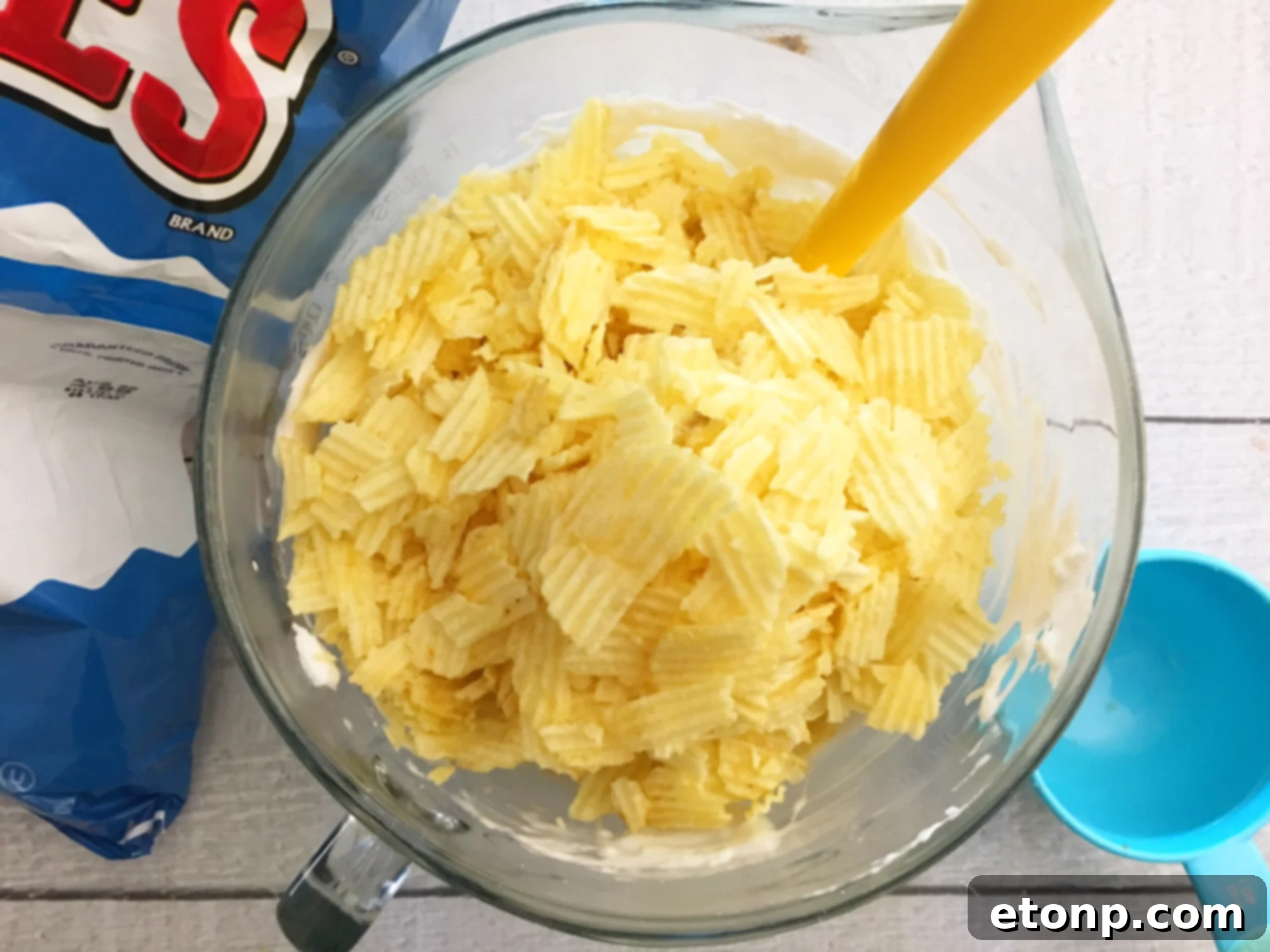 Close-up of Ruffles Krispie Treats, showcasing the texture of the crushed chips bound by marshmallow, ready for serving.