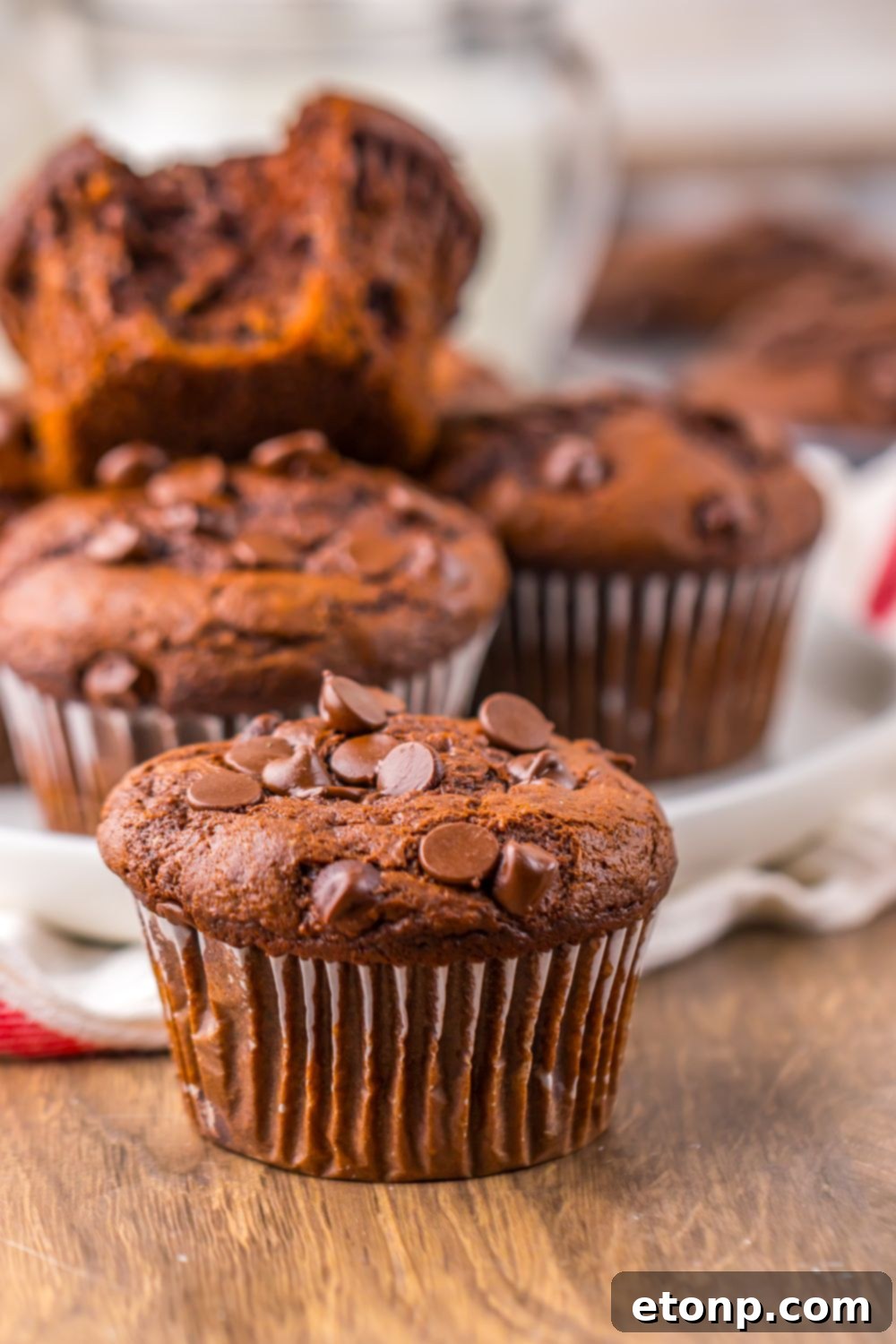 Costco Double Chocolate Muffins Bakery Style Jumbo Rich Moist 19 Costco Double Chocolate Muffins casually arranged on a table with a decorative towel.
