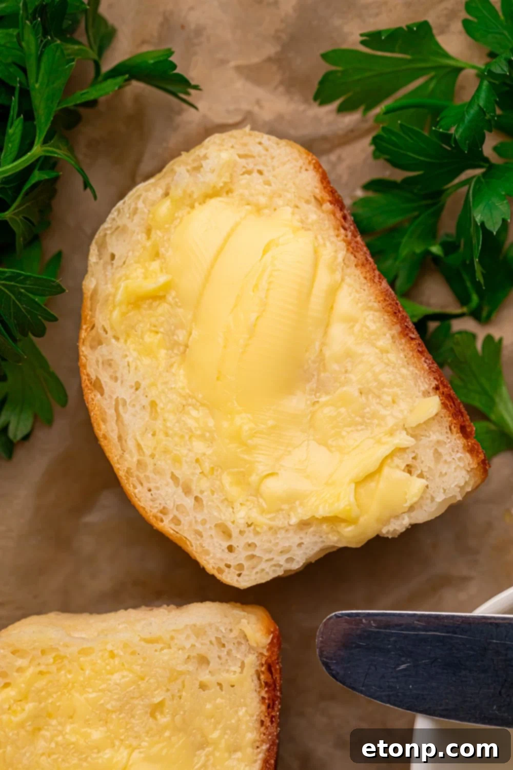 2 Ingredient Dinner Rolls sliced in half spread with butter and herbs to side 