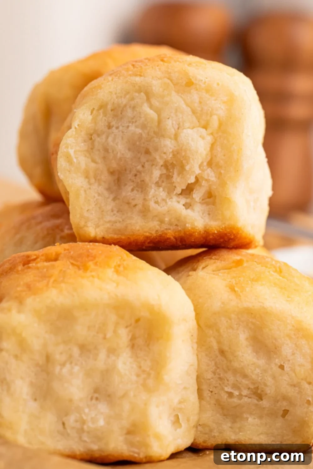 2 Ingredient Dinner Rolls stacked on table to show how fluffy they are 