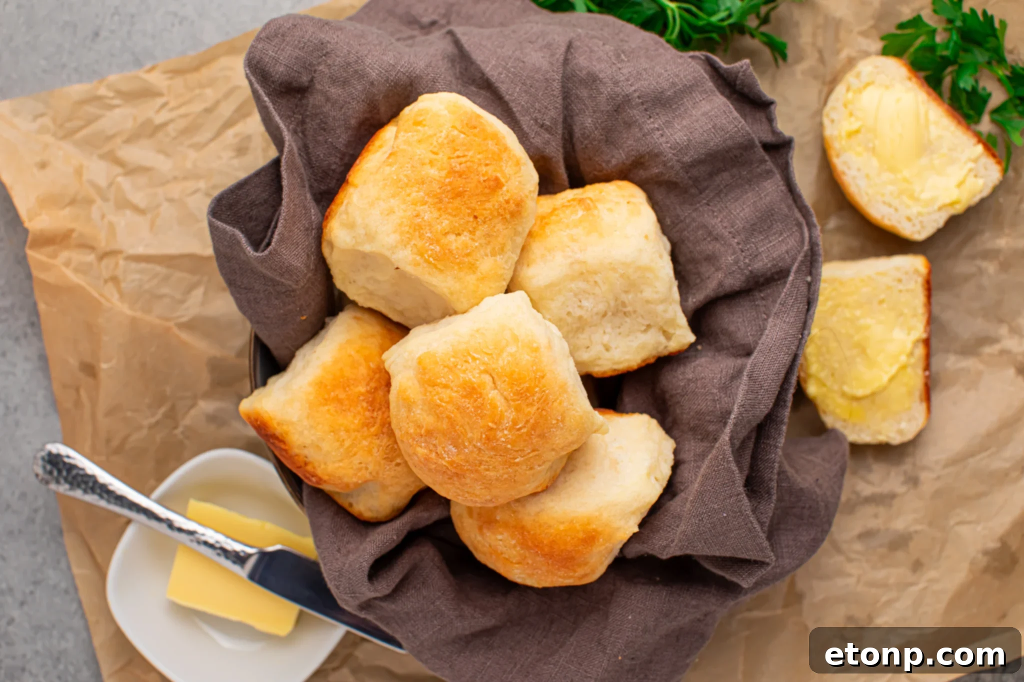 2 ingredient dinner rolls in a bread basket with a side of butter