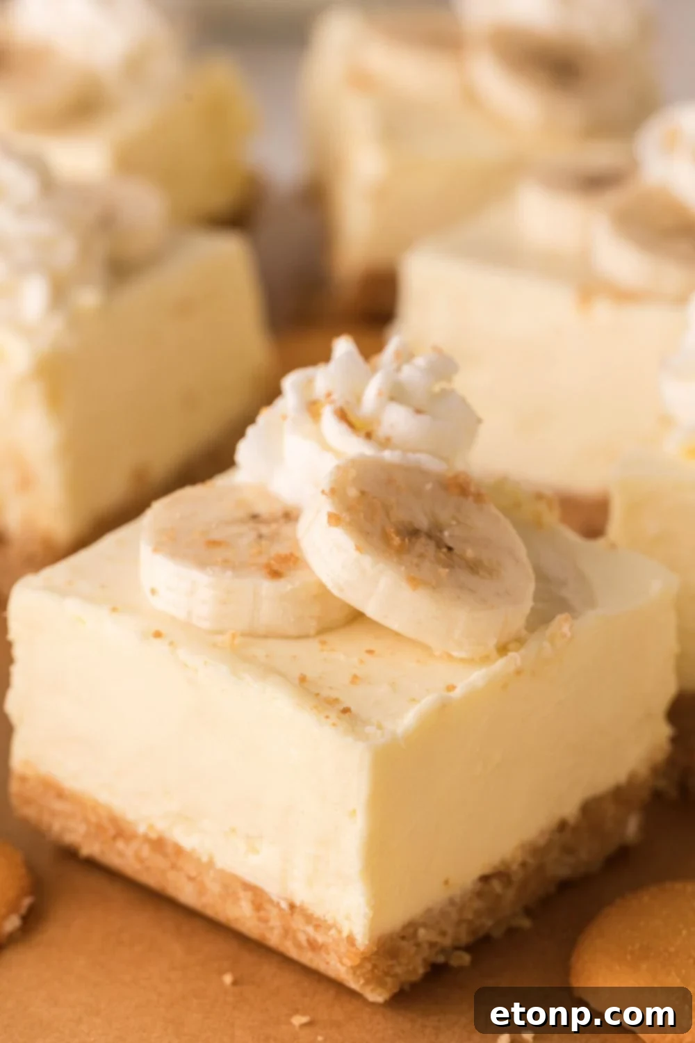 sliced No Bake Banana Pudding Cheesecake Bars cut into squares nicely placed on table 