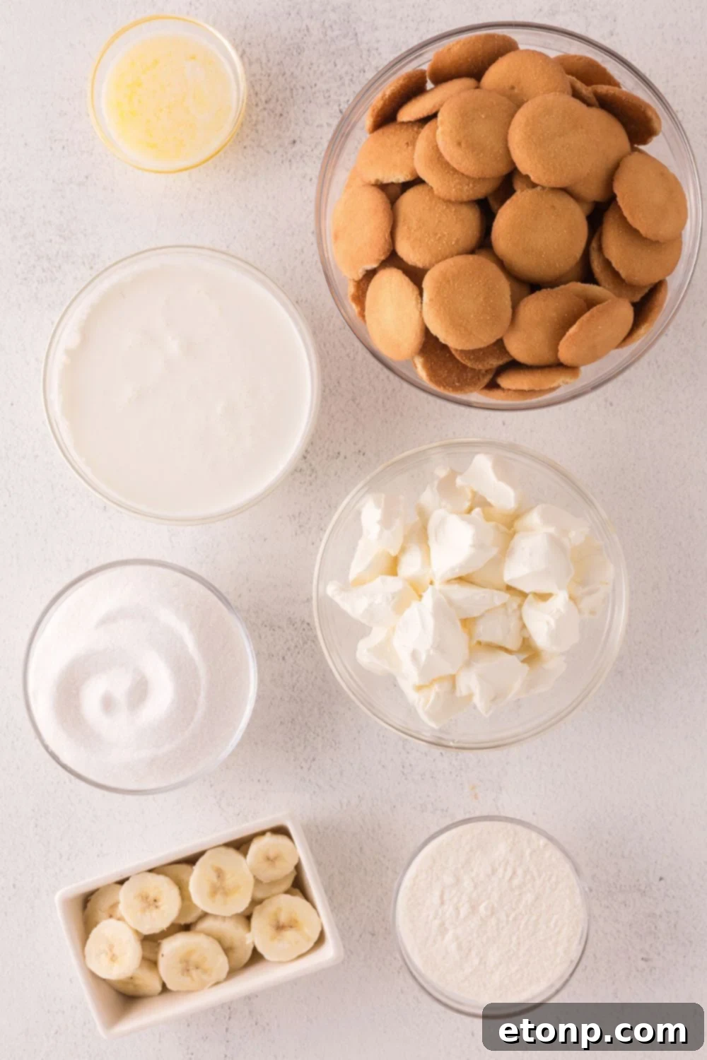 ingredients in small bowls on table for No Bake Banana Pudding Cheesecake Bars