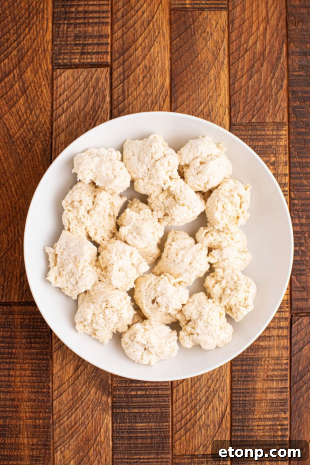 Easy Buttery Garlic Parmesan Breadsticks Two Ingredients 8 Several small balls of 2-Ingredient Garlic Parmesan Breadsticks dough portioned on a plate