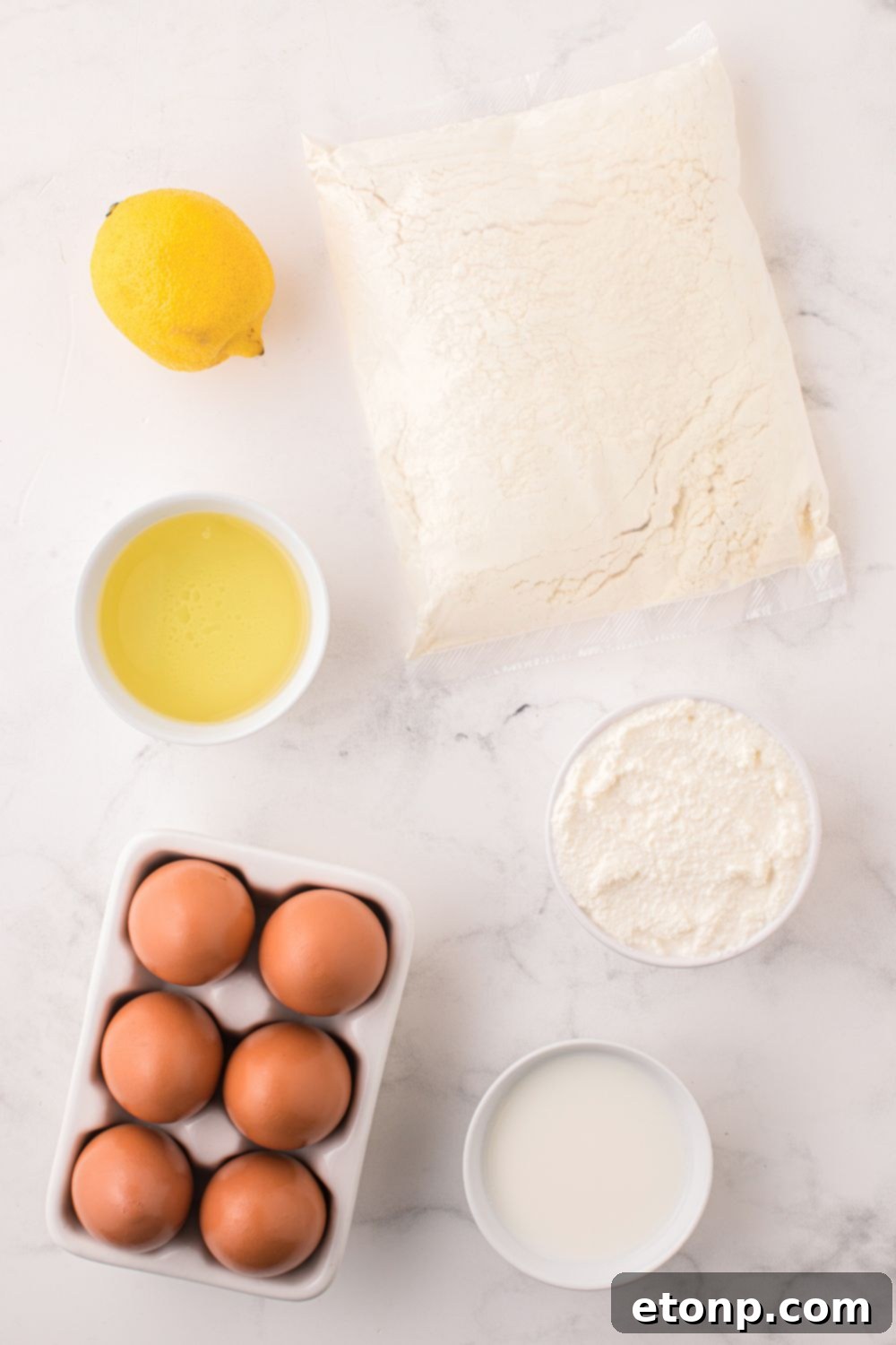 Effortless Italian Lemon Ricotta Cake: Light and Lemony Perfection 7 Individual containers hold the key ingredients for the Italian Lemon Ricotta Cake, neatly arranged on a table, symbolizing simplicity and freshness.