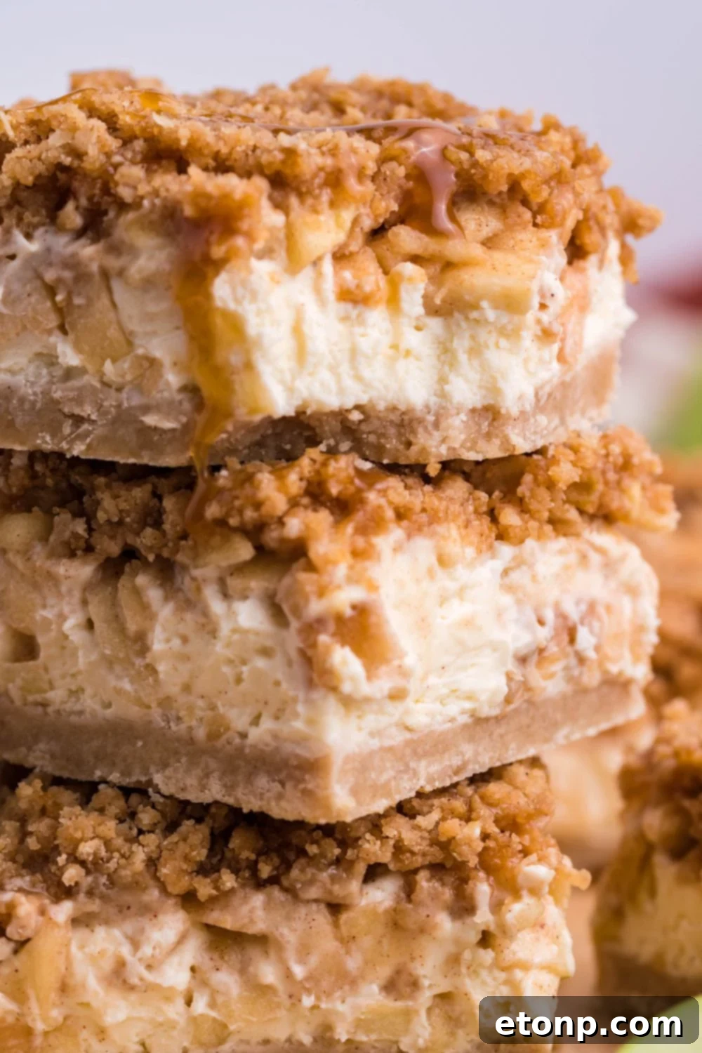 stack of Caramel Apple Cheesecake Bars on table