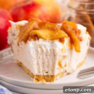 No Bake Apple Cheesecake slice on a stack of white serving plates