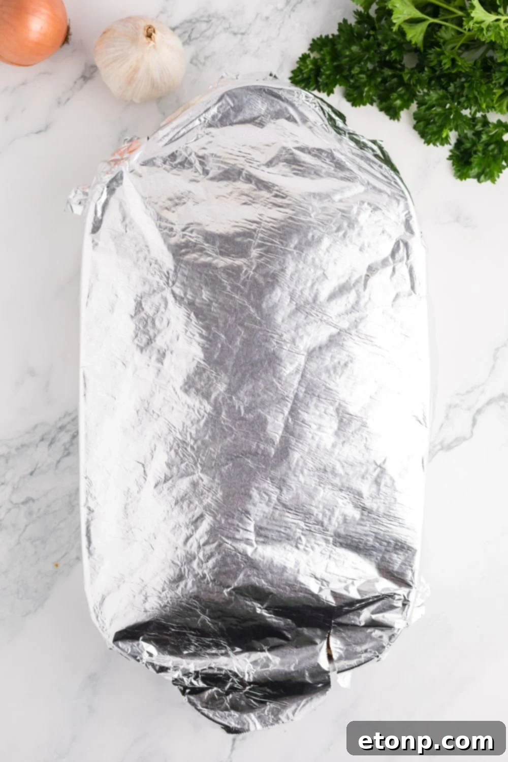 foil covered casserole dish on table 