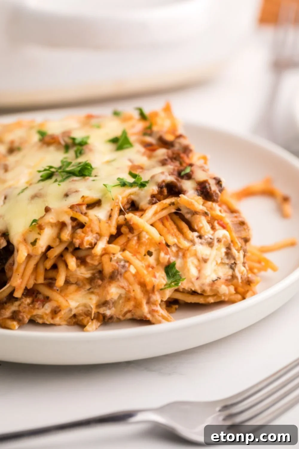 close up of Million Dollar Spaghetti Casserole on plate 