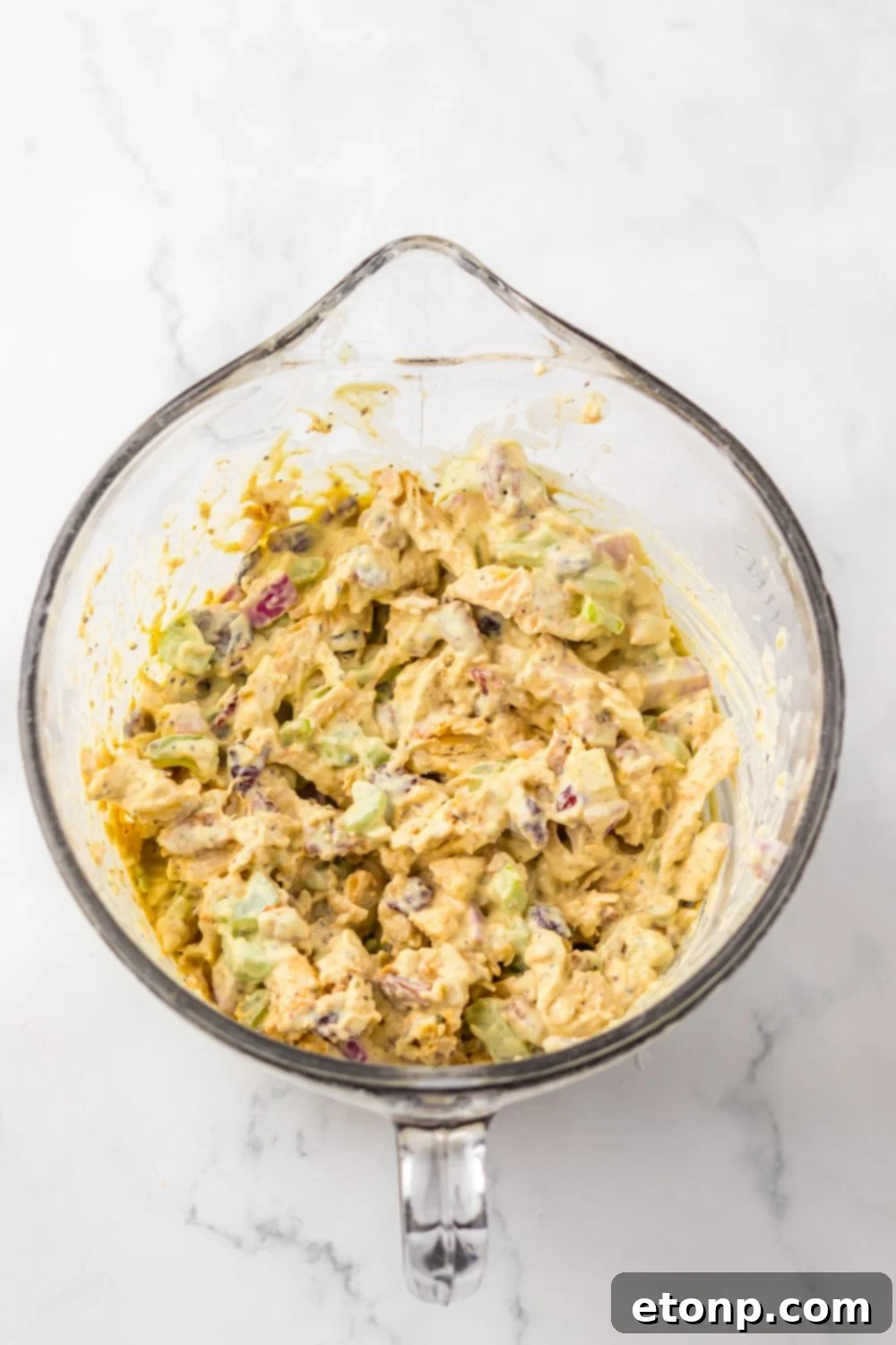 Thanksgiving Turkey Salad mixed up together in a measuring cup 