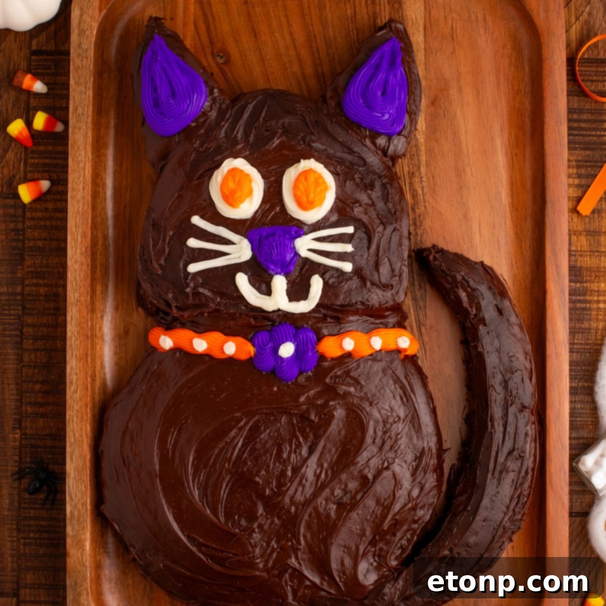 A beautifully decorated Easy Halloween Black Cat Cut Out Cake on a serving tray, ready for a festive celebration.
