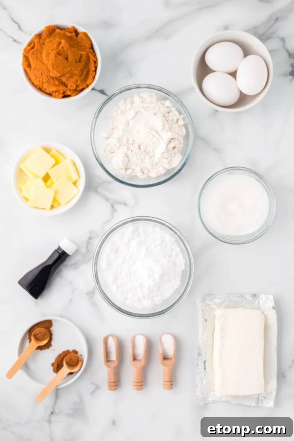 All the ingredients for Pumpkin Cake Roll in single serve containers on table to show all the ingredients you will need.