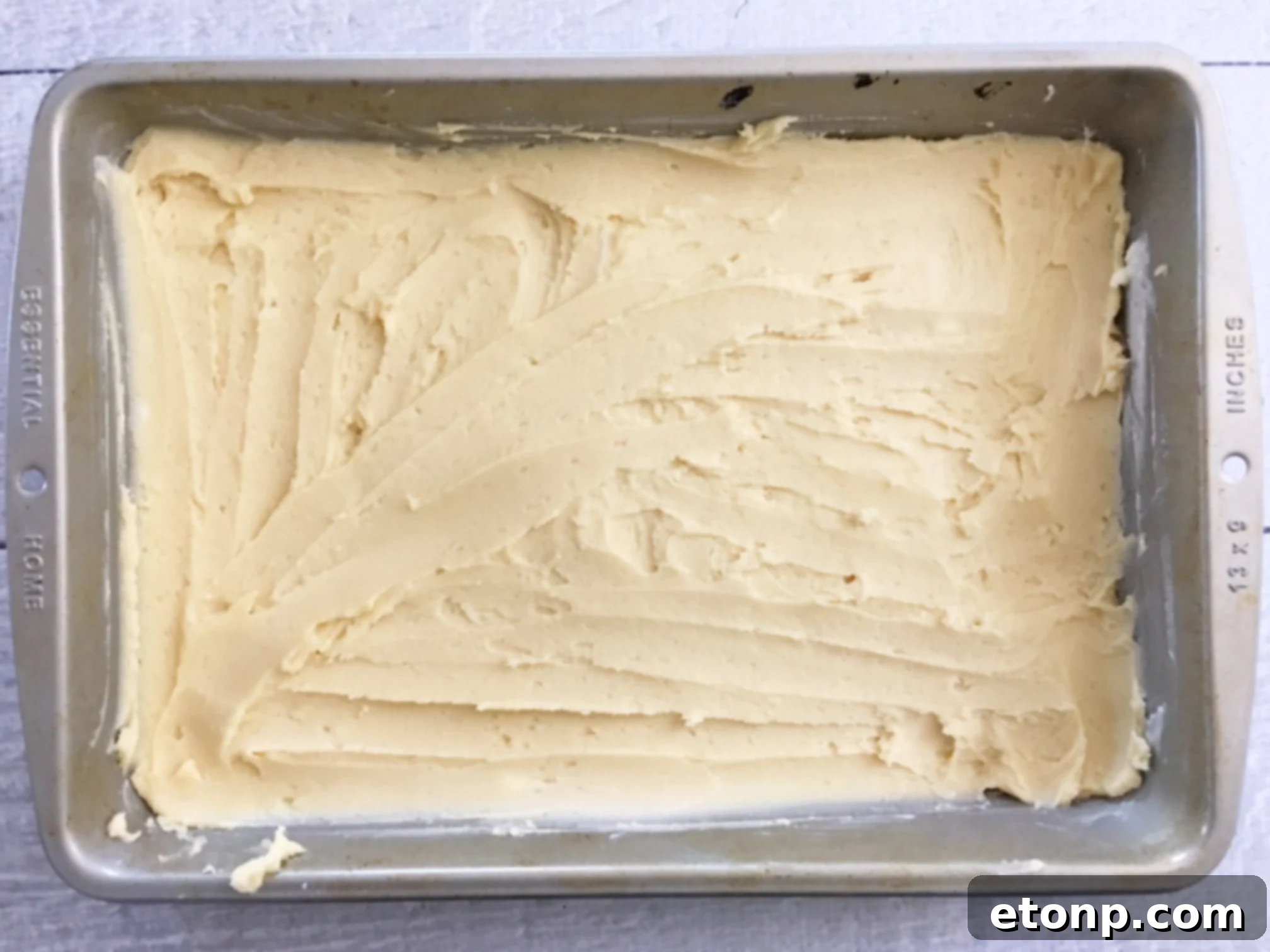 A tray of freshly baked Pecan Pie Bars, glistening with their sweet pecan topping.
