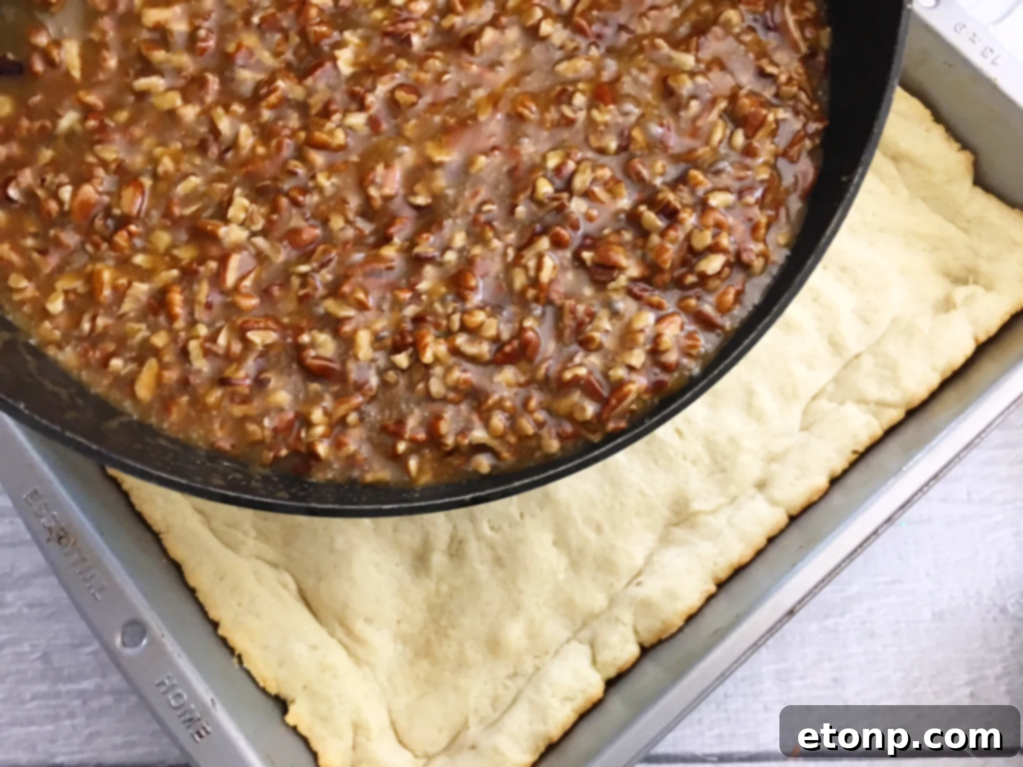 Several Pecan Pie Bars neatly stacked on a plate, ready to be served and enjoyed.