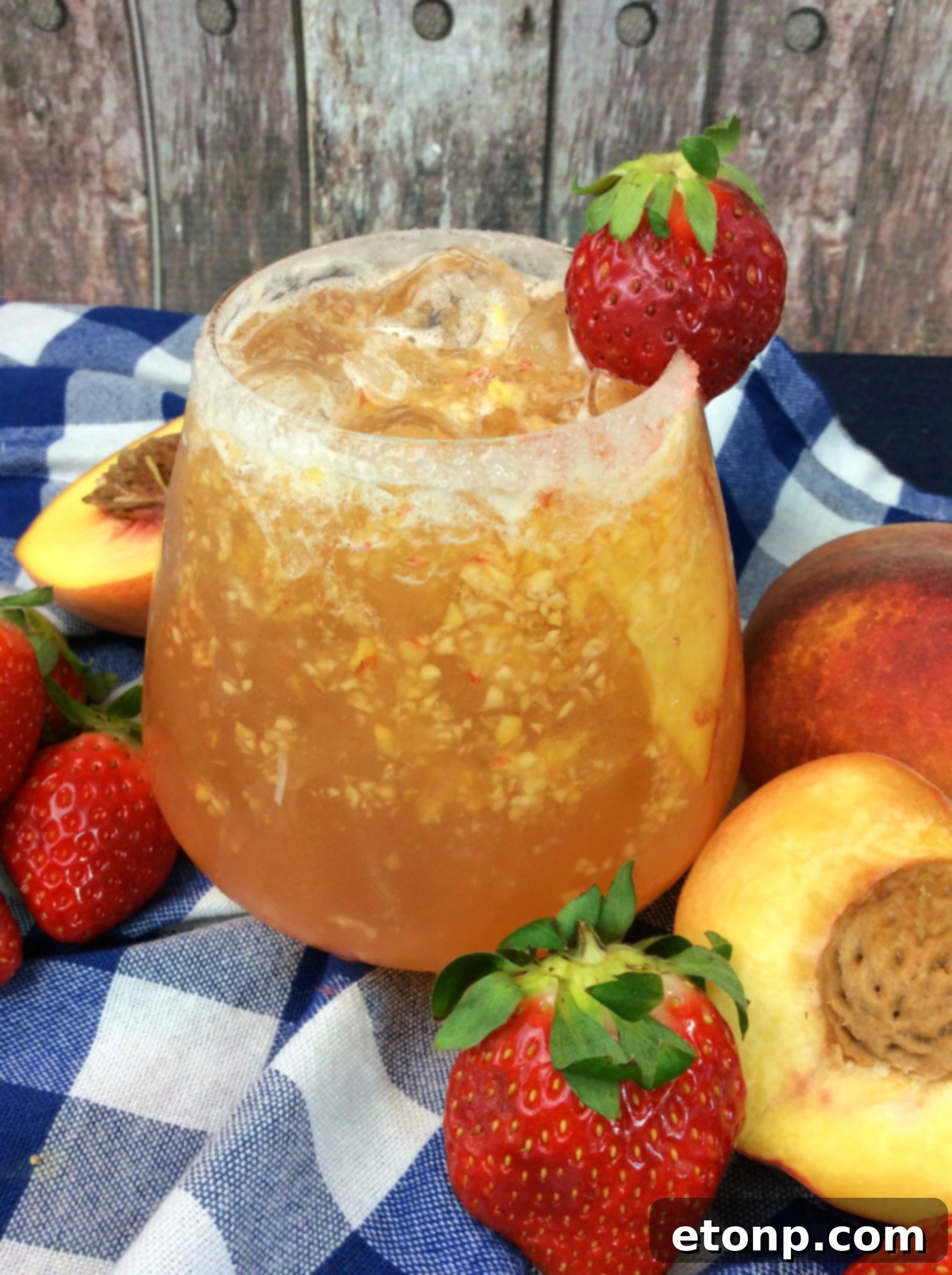 Collection of various cocktail ingredients and fresh peaches