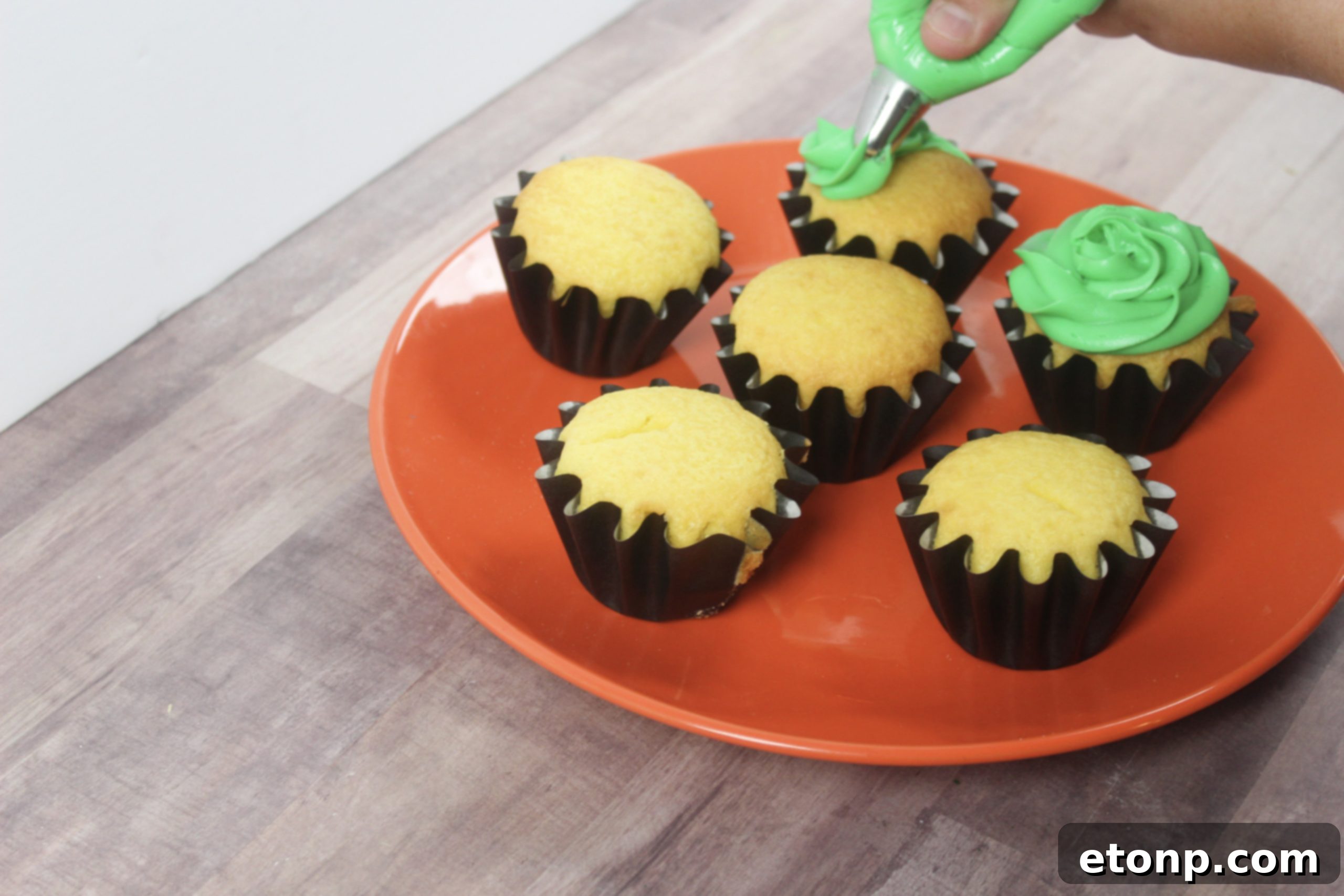 Freshly baked plain cupcakes ready for Halloween transformation