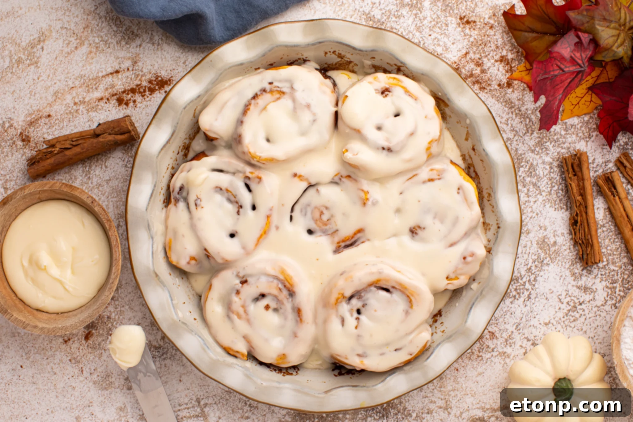 Effortless 2-Ingredient Pumpkin Cinnamon Rolls No Yeast 25 Overhead shot of the Easy 2 Ingredient Pumpkin Cinnamon Rolls in a baking dish smothered in icing