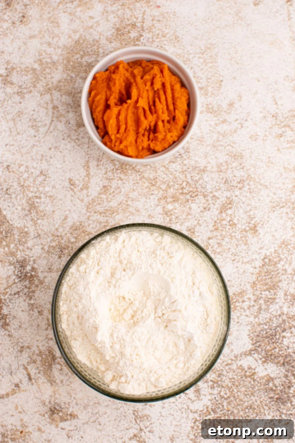 Effortless 2-Ingredient Pumpkin Cinnamon Rolls No Yeast 5 pumpkin puree and self rising flour in glass containers on table