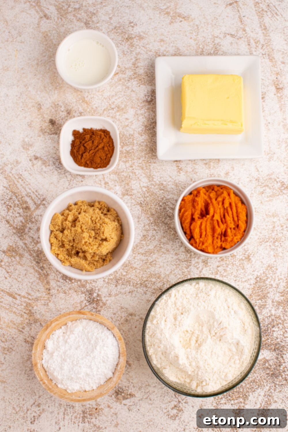 Effortless 2-Ingredient Pumpkin Cinnamon Rolls No Yeast 6 all the ingredients to make Pumpkin Cinnamon Rolls in small containers on table