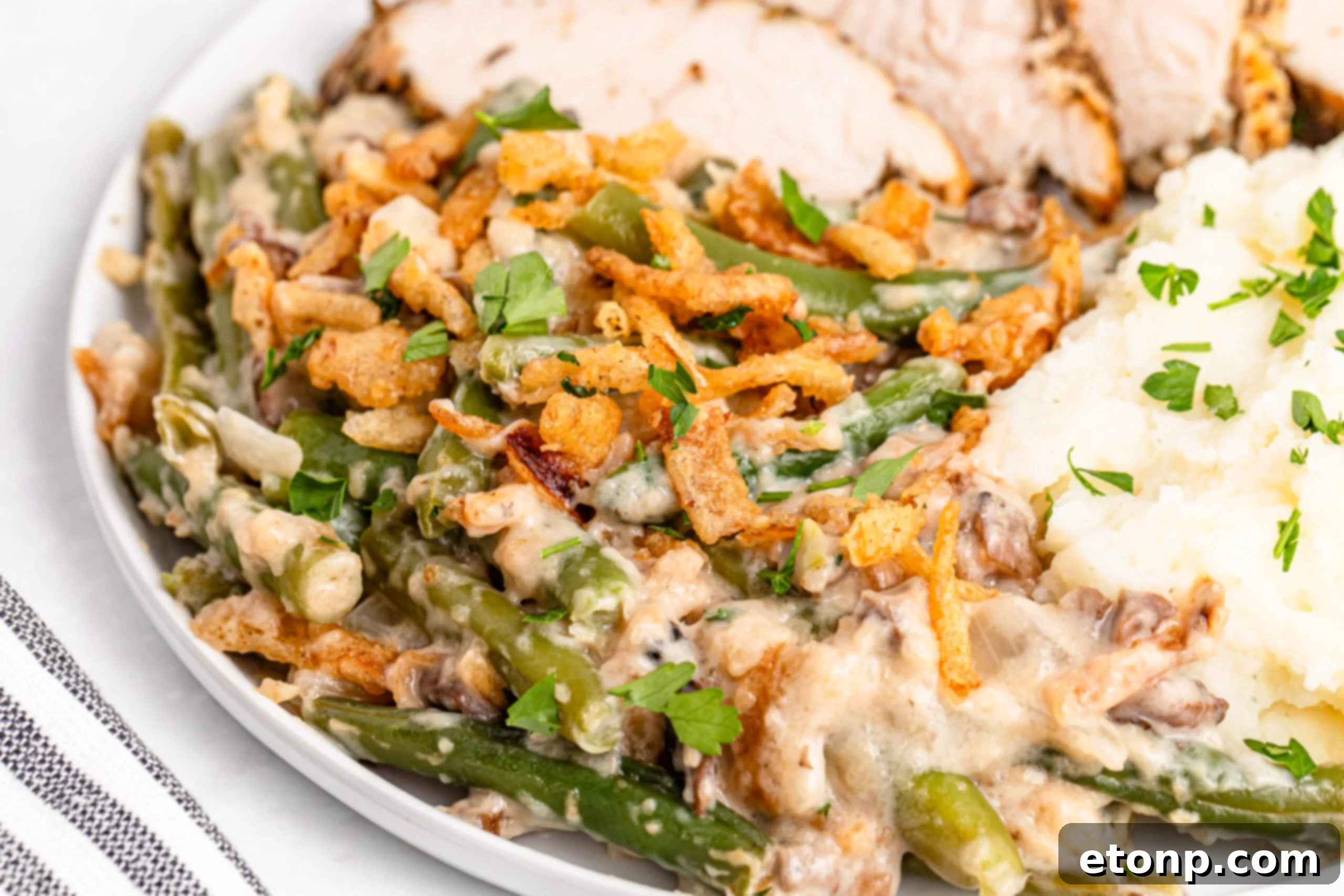 Up close of a plate filled with the Best Ever Green Bean Casserole