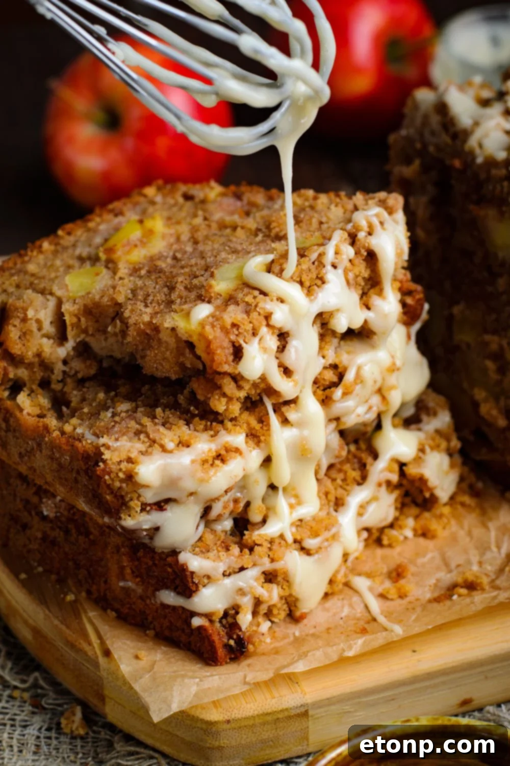 Apple Cinnamon Loaf Cake stacked 3 pieces and a bit of a glaze drizzling down onto the bread