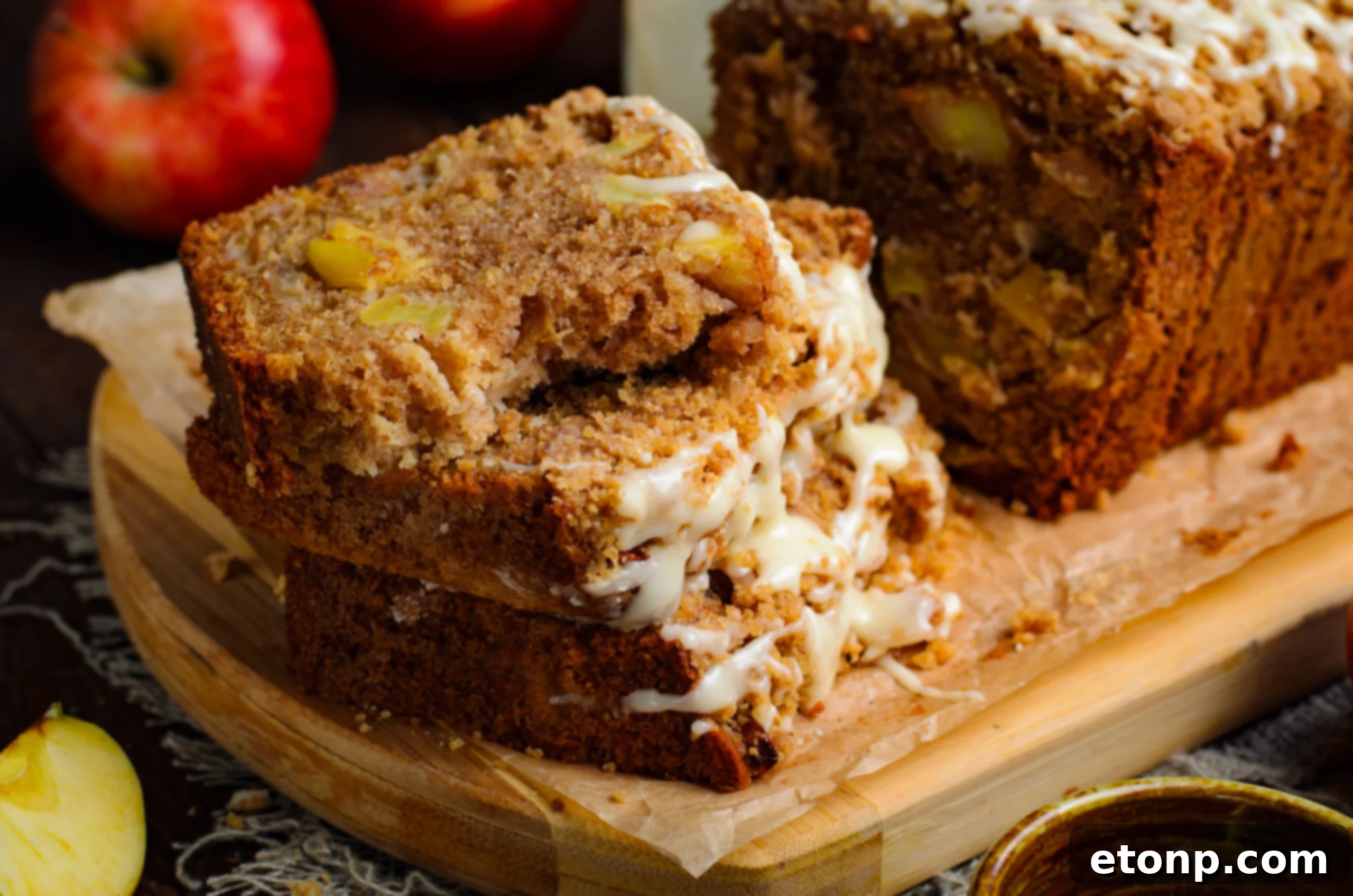 close up view of 4 stacked slices of the Apple Cinnamon Loaf Cake with glaze