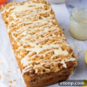 Apple Cinnamon Loaf Cake on the table with a jar that had glaze sitting next to it