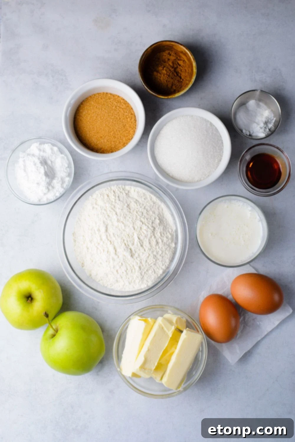 ingredients in single serve containers to make Amish Apple Fritter Bread on a marble counter