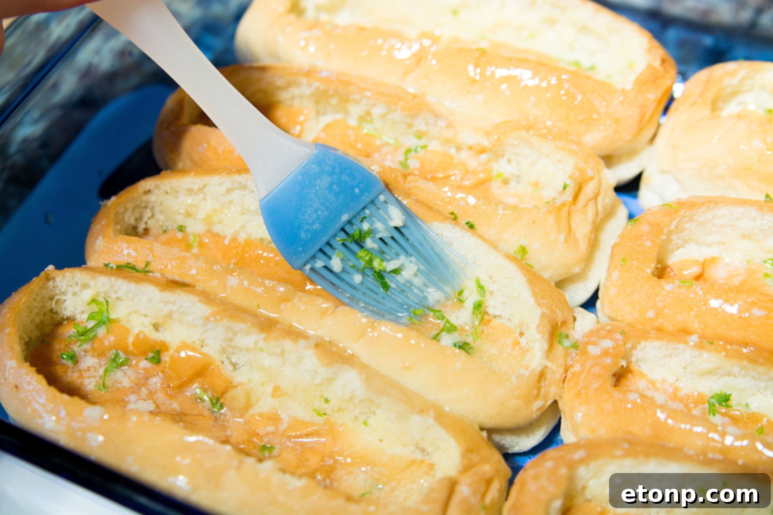 Loaded Chili Cheese Dog Boats 6 Close-up of hot dog buns with the center bread pressed down, forming the 'boat' base.