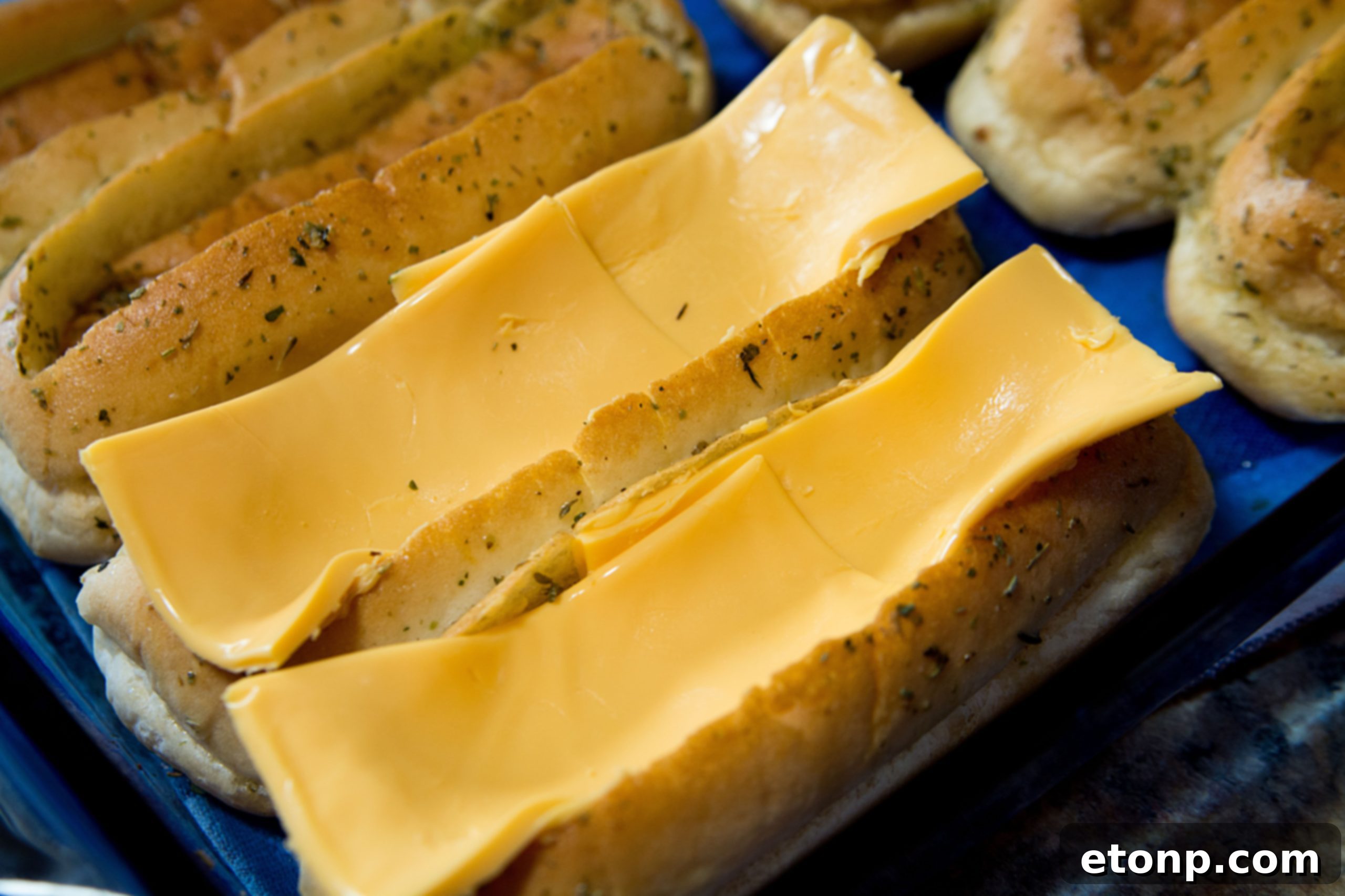 Loaded Chili Cheese Dog Boats 7 Brushing hot dog buns with a delicious garlic butter and parsley mixture.