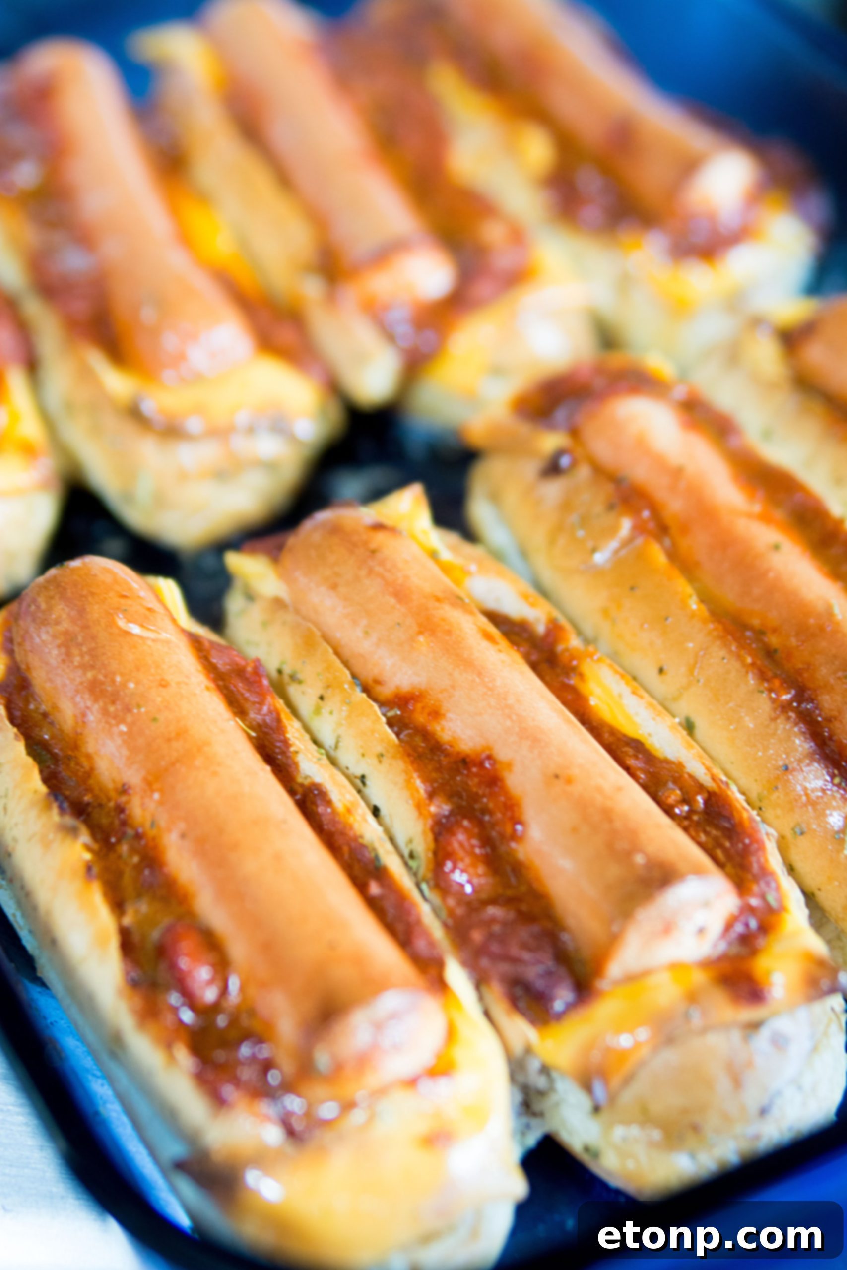 Loaded Chili Cheese Dog Boats 9 Hot dogs placed inside chili and cheese filled buns.