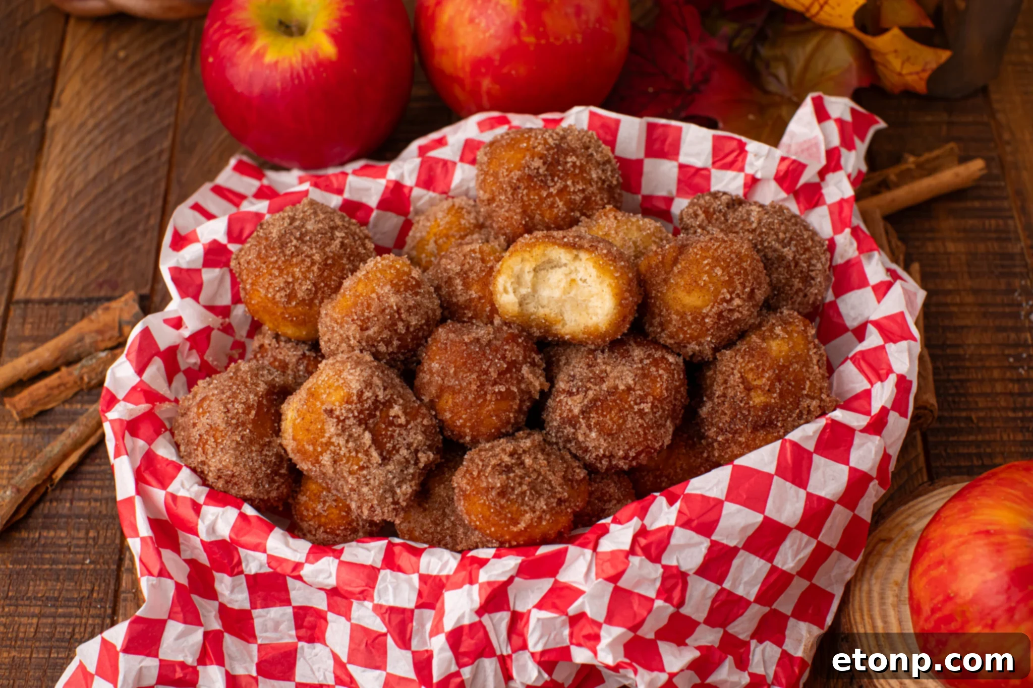 basket full of Apple Pie Donut Holes  in a checked serving basket 