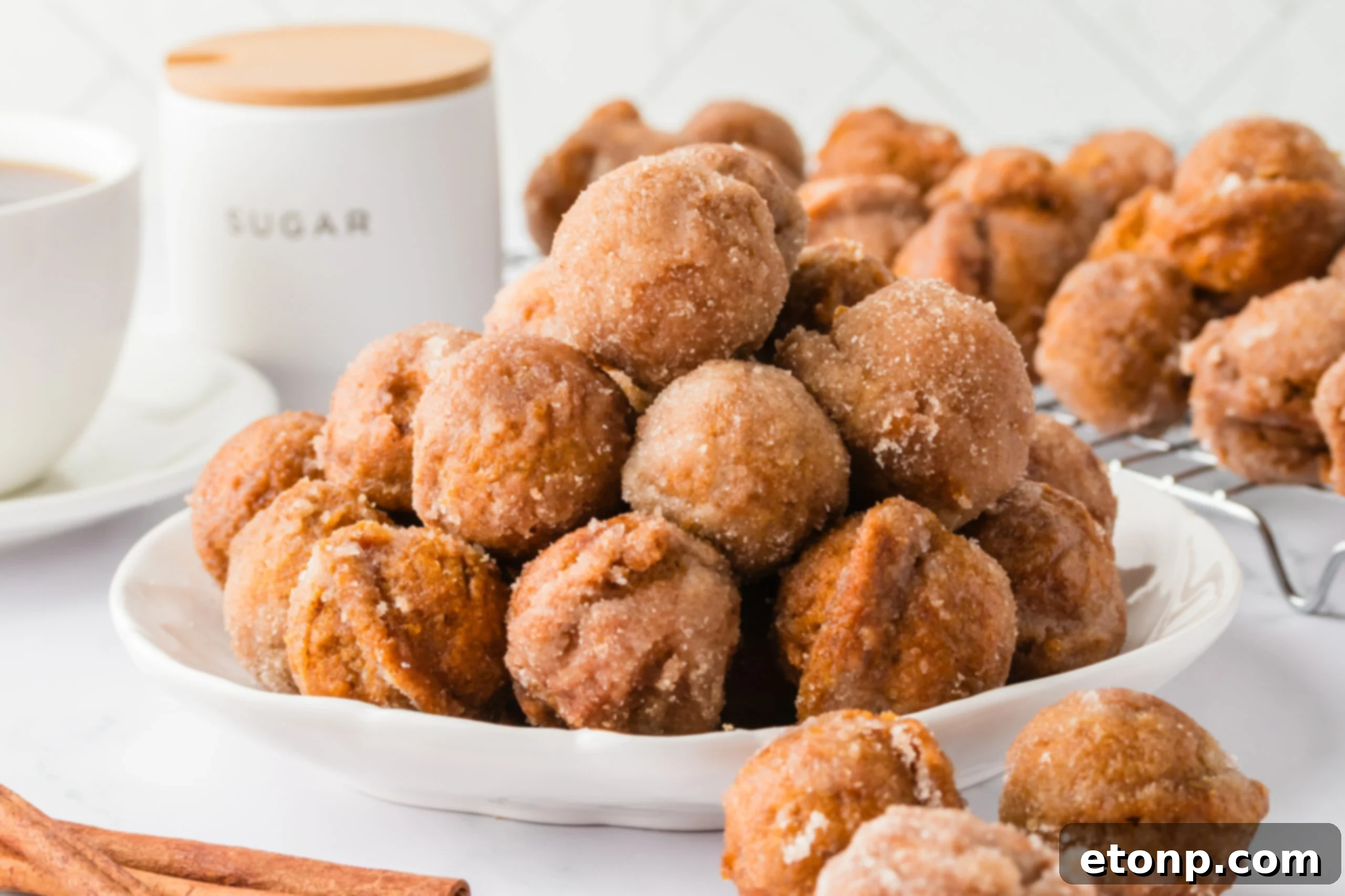 White plate with piled Pumpkin Spice Donut Holes 