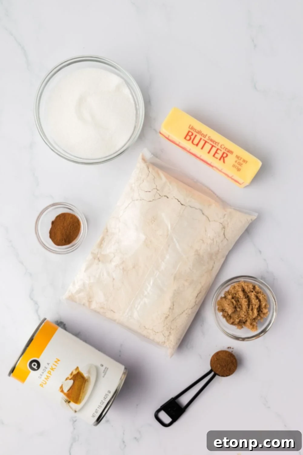 ingredients for making Baked pumpkin donut holes spread out on table in single serve containers 