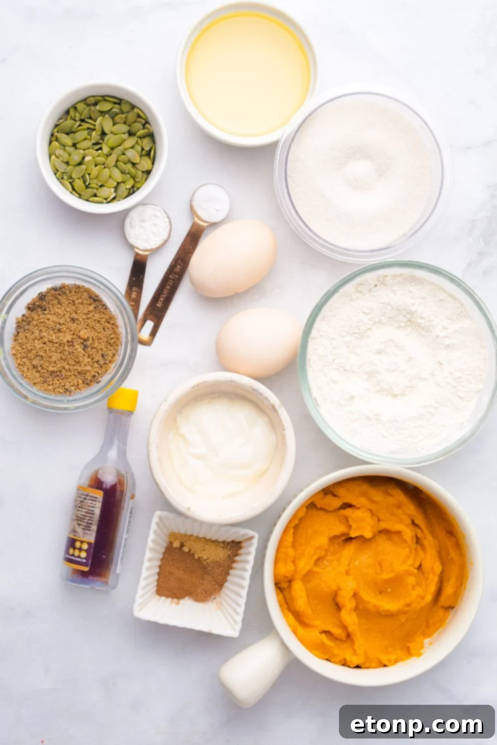 all the ingredients for Starbucks Pumpkin Bread in single serve containers on a white table 