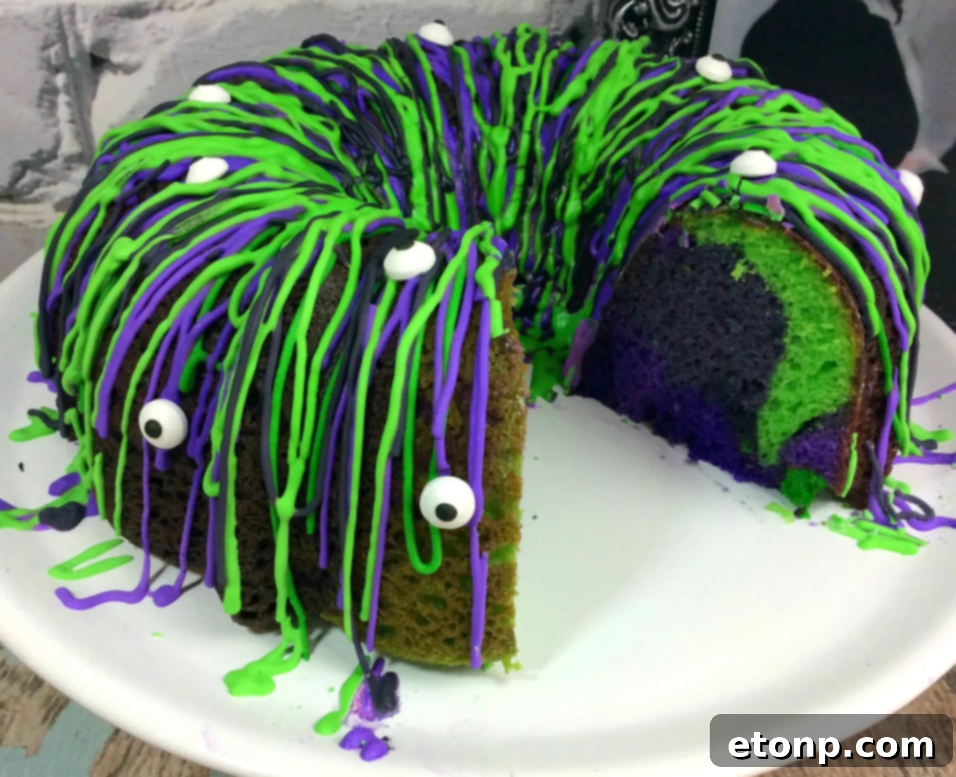 Witches Brew Halloween Cake showing the marbled interior colors of purple, black, and green