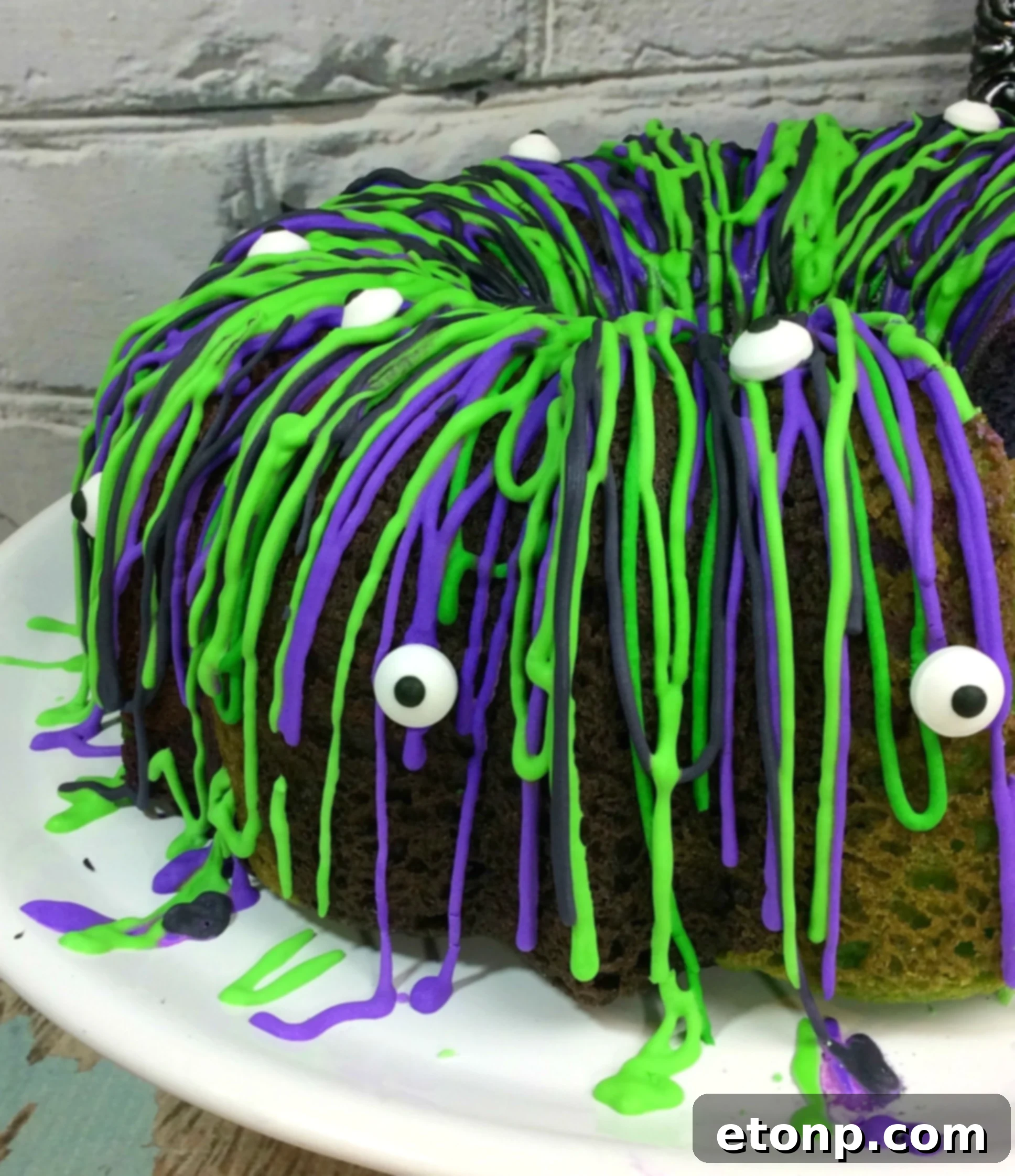 A closer look at the Witches Brew Halloween Cake, highlighting the textured royal icing and vibrant cake