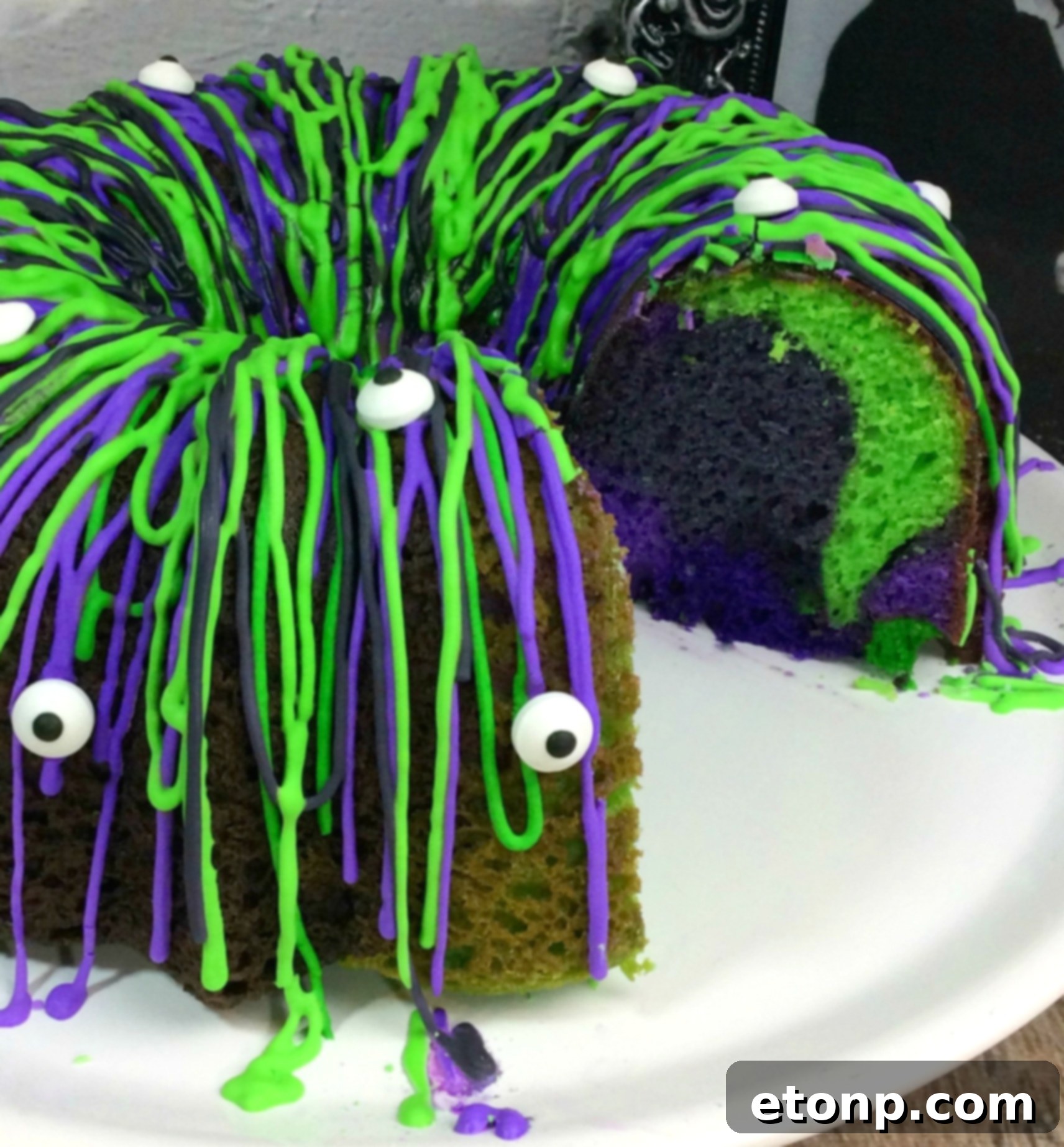 Top view of Witches Brew Halloween Cake adorned with numerous edible eyes