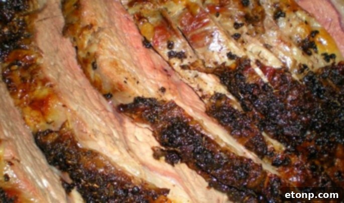 Raw prime rib roast being prepared with seasonings