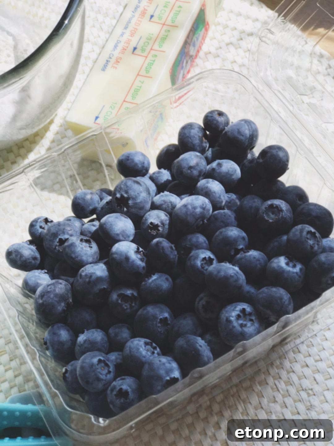 Ingredients for blueberry muffin mug cake being mixed in a bowl