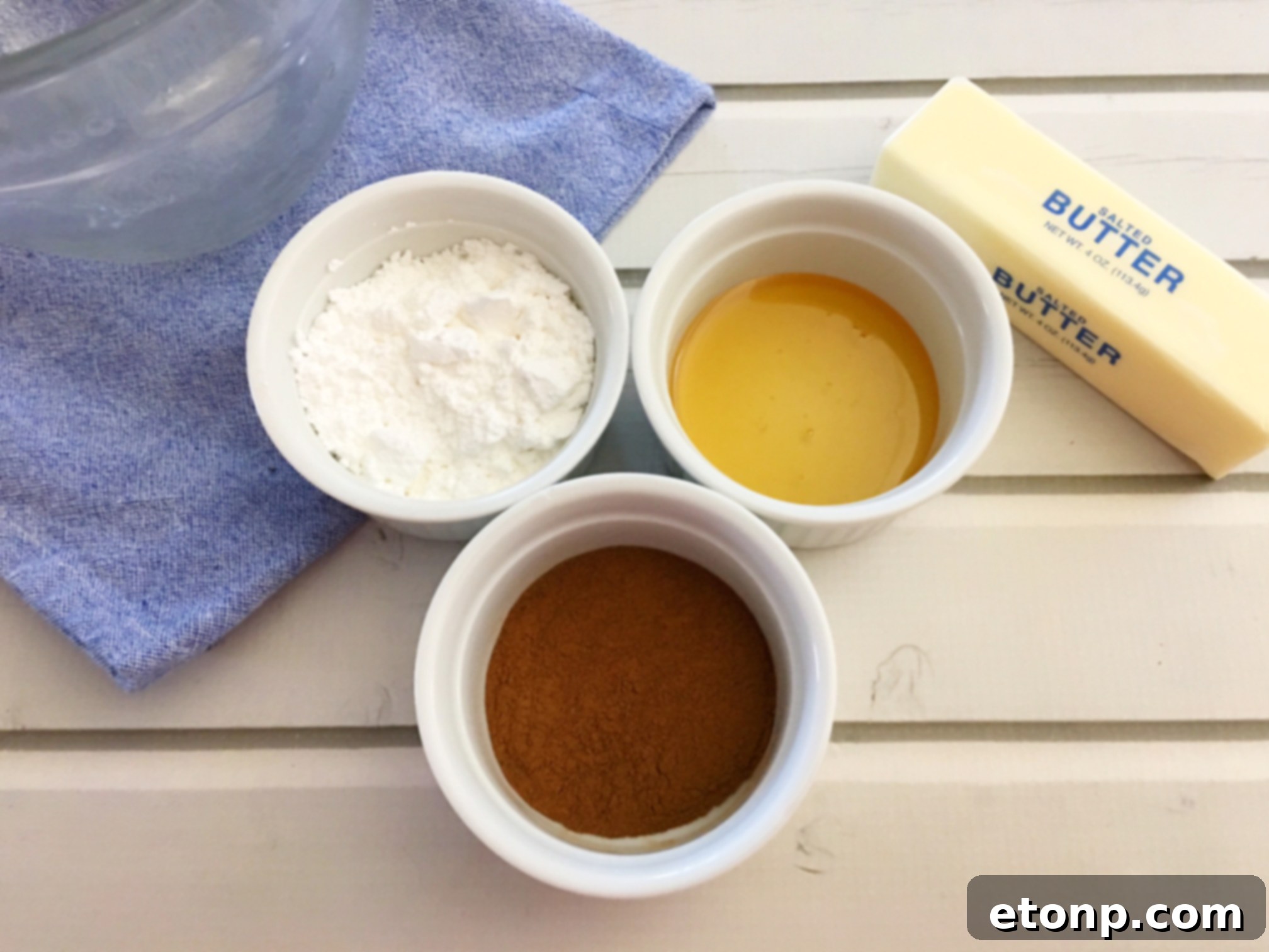 Cinnamon Honey Butter in a small white dish, with a spoon