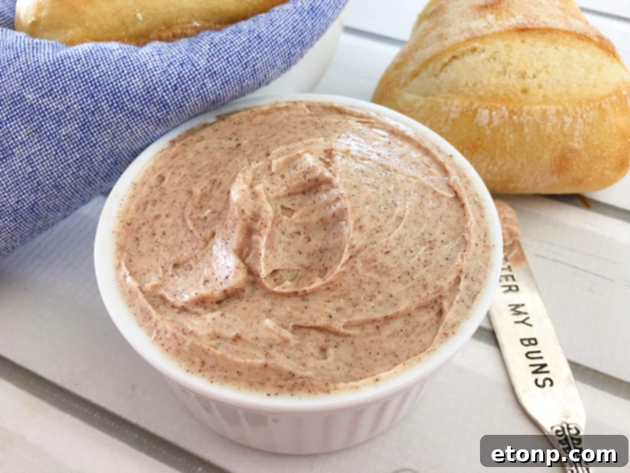 Close-up of fluffy homemade cinnamon honey butter in a small dish