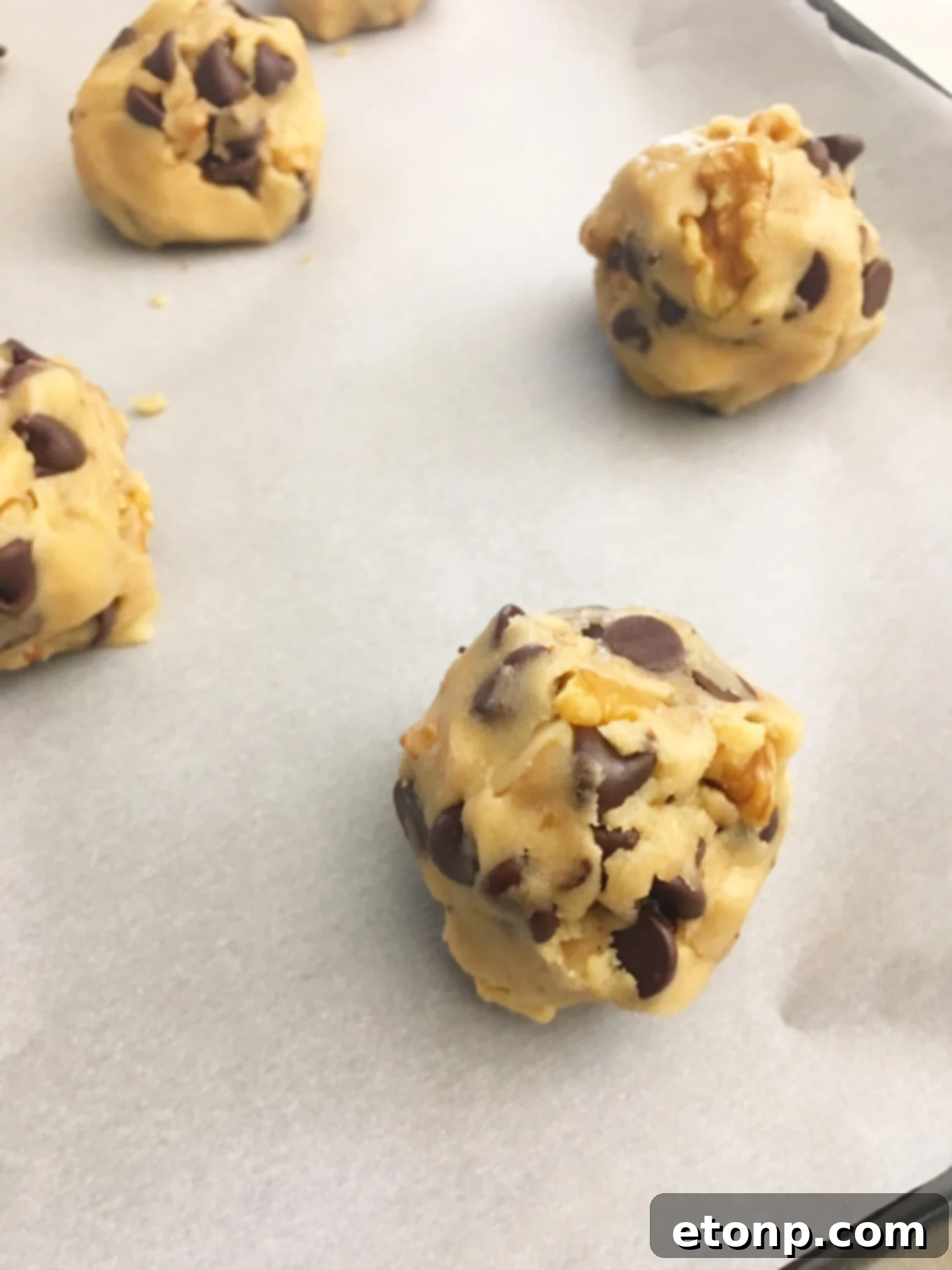 Close-up of a perfectly baked Toll House chocolate chip cookie with melted chocolate chips