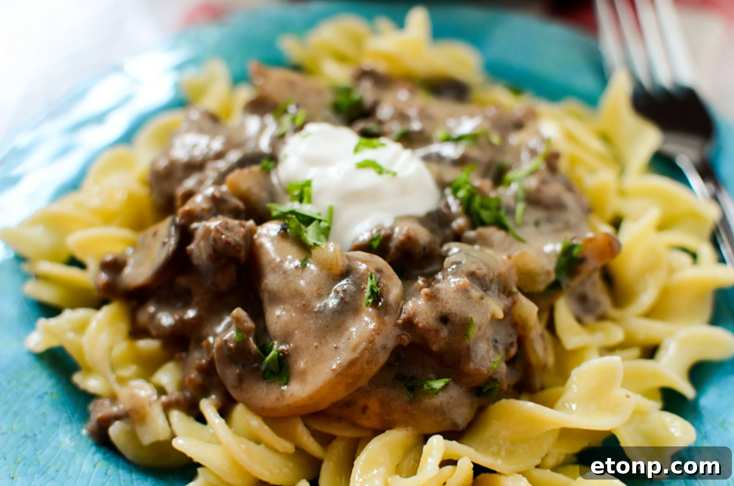 One-skillet stroganoff ready to be served, showing rich textures.