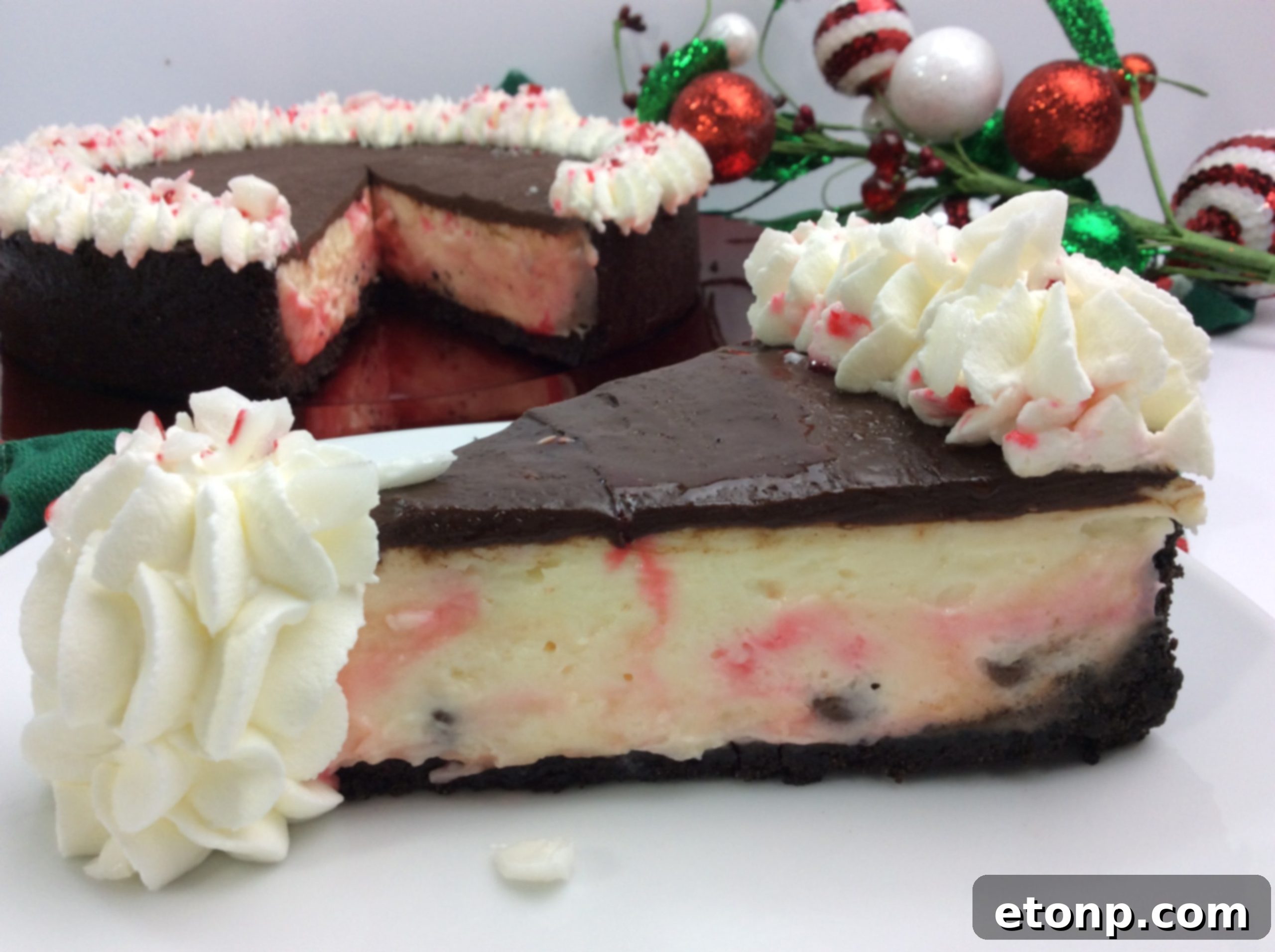 Close-up of a festive Candy Cane Cheesecake slice