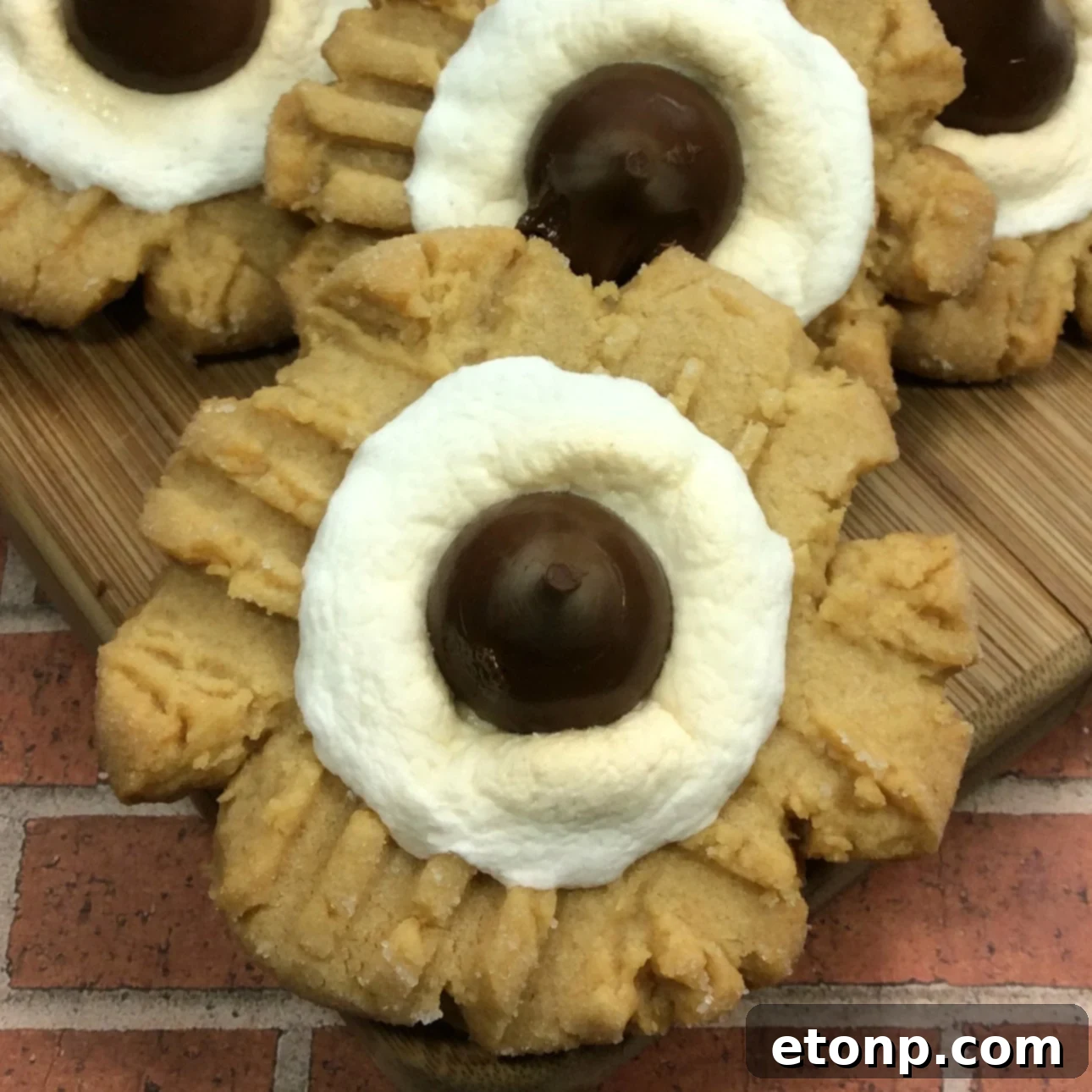 Stack of Peanut Butter S'mores Cookies on a white plate