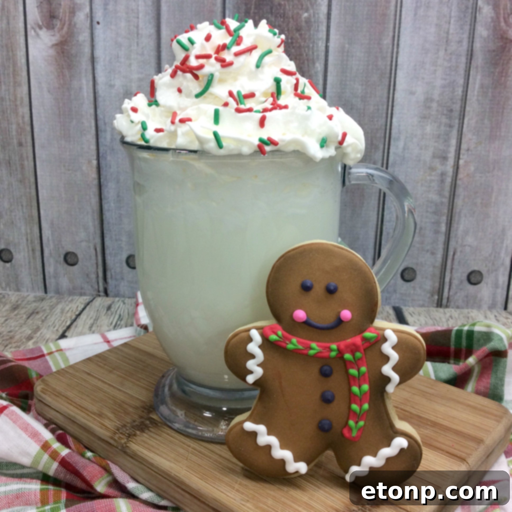 Starbucks Secret Sugar Cookie Hot Cocoa Unlocked 3 Overhead shot of two mugs of Sugar Cookie Hot Cocoa, with a small pitcher of milk and cookie crumbs nearby